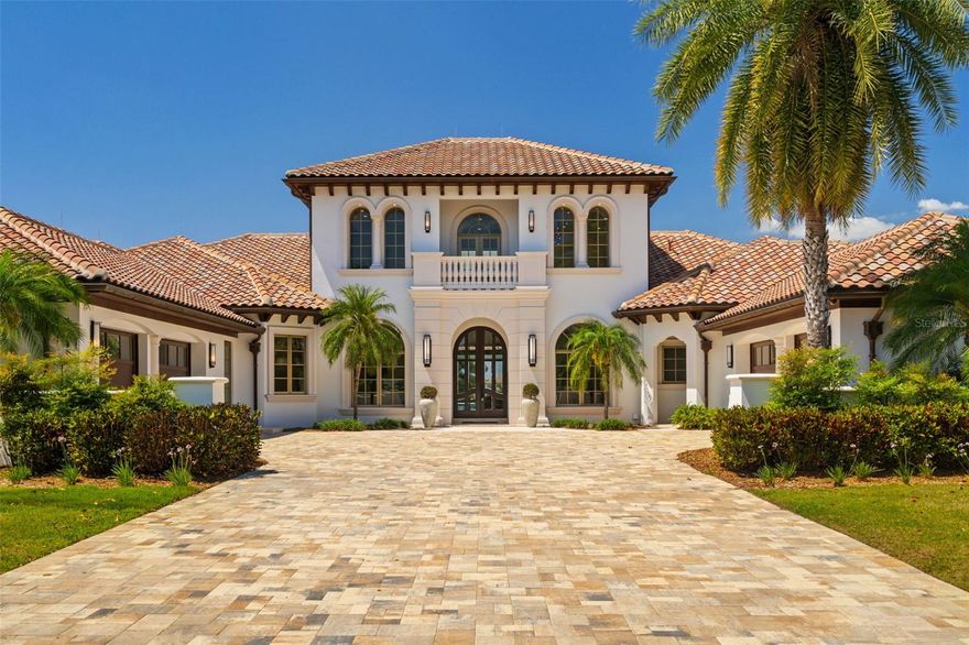 Fall in love with this extraordinary fully renovated lakefront estate by Davila Homes, an award-winning builder known for visionary design and unmatched craftsmanship. Located in the exclusive Isle of Lake Hancock—a private, gated enclave of just 34 homes—this is a rare opportunity to own a true masterpiece with lake views in both the front and back.

From the moment you enter the soaring double-height foyer, you’re greeted with sleek elegance and modern sophistication. A striking round glass staircase leads to a stylish loft, while the open-concept main floor flows effortlessly through light-filled living spaces that embrace Florida’s indoor-outdoor lifestyle.

The primary suite is a showstopper—massive in scale with a walk-in closet you’ll never want to leave and a spa-inspired bathroom that feels like a private retreat. The home also features a private gym, a versatile bonus room for entertaining, and designer finishes in every corner and a rare to find eight car garage.

Step outside to a resort-style lakeside lanai, complete with a screen-enclosed pool and panoramic water views. Whether you're sipping coffee at sunrise or hosting sunset gatherings, the setting is pure magic.

Set on the pristine Lake Hancock chain, this is a water lover’s dream—ideal for boating, wakeboarding, and skiing with access to two world-class slalom courses. Just minutes away, Hamlin Town Center offers future dock access to shops, dining, and entertainment. And with Disney, Winter Garden, and Windermere close by, you’re at the center of it all—yet worlds away.

Homes in this community almost never hit the market—and certainly not like this.
If you’ve been waiting for something extraordinary, this is it.
Schedule your private showing today.