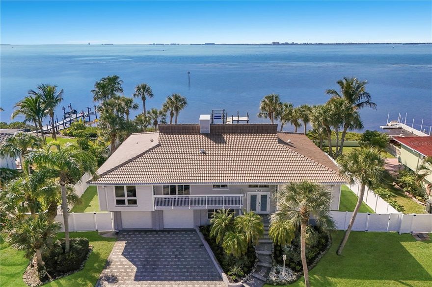 This 6BD/3BA waterfront home was designed for both comfort and easy living. From the moment you step inside, this home offers the space, layout, and setting that makes everyday living feel effortless. The soaring ceilings and wide plank flooring set the tone for a bright, open main level where the living and dining areas flow naturally together, all framed by expansive sliding glass doors that draw your eye straight to the water. The kitchen is fresh and functional, featuring crisp white cabinetry, stainless steel appliances, and generous counter space that makes both everyday meals and entertaining effortless. The thoughtful layout offers great sized bedrooms that provide flexibility, along with updated bathrooms that feel clean and timeless. Downstairs, a second family room provides an entirely separate living area that opens directly to the backyard and pool. You’ll also find a spacious laundry room, offering plenty of room for storage, organization, and handling everyday tasks with ease. This lower level creates a natural divide for entertaining and everyday living, giving the home a versatility that’s hard to find. With plenty driveway parking, a spacious garage, and a layout that balances openness with defined spaces, the home feels both substantial and inviting. This home is ready to accommodate the rhythm of daily life while still embracing its beautiful waterfront setting. Beyond the walls of the home, the location adds even more appeal. Just minutes from IMG Academy and the renowned IMG Academy Golf Club, and close to the sandy beaches of Anna Maria Island, you’re perfectly positioned for both recreation and relaxation. Enjoy nearby dining and shopping options, an easy commute to the SRQ Airport, and an abundance of arts and cultural experiences that make this area such a sought-after place to call home.
