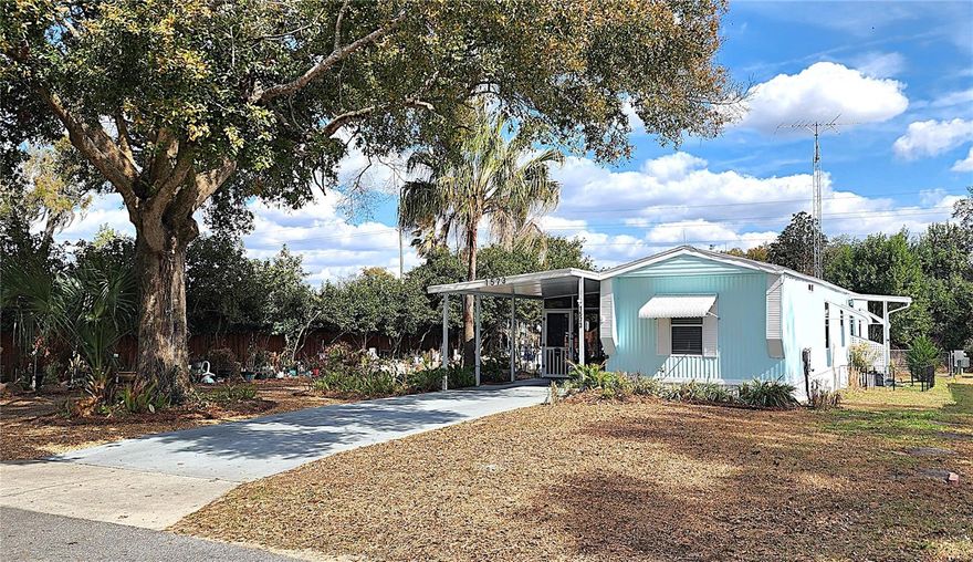 Hey Nature and Gardening Enthusiasts… This Fully Renovated 2-Bedroom, 2-Bathroom Move-In Ready Home is Surrounded by Gardens, Mature Trees, and Vibrant Foliage.  Enjoy Bird Watching and Tranquil Views from your 30’ Screened Lanai. Great as a Rental Property too. INTERIOR: Great Room includes the Family/Kitchen/Dining Areas.  KITCHEN: Numerous Cabinets, Tons of Counter Space,  LVP Flooring, and Newer Kitchen Appliances. BATHROOMS:  New Adorable Mirrors, Cabinets, Hardware, Fixtures.  EXTERIOR: NEW PAINT AND SKIRTING. NEW 240sf ENCLOSED ROOM off the Lanai w/Heat and Cooling and Sliders out to the NEW DARLING COVERED PORCH.  Triple-filter Water Filter, Water Softener, ADDITIONAL RV DRIVEWAY w/POWER POLE and Close-by Water Connection.  LOCATION, LOCATION, LOCATION !! Conveniently Located Only 10 Miles to Ocala for Big City Shopping or 6 Miles to Lecanto for Suburban Shopping. Withlacoochee State Trail and River are practically in your backyard, and you’ll be Only 10 Miles to Crystal River to Enjoy the Gulf Side of Florida!  NOTE: Drapes, Rods, Valances do NOT convey.