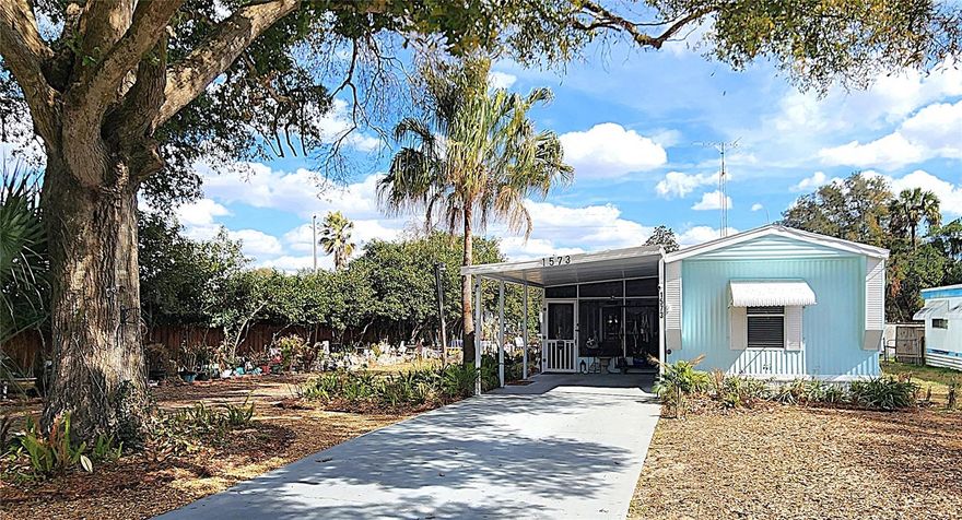 Hey Nature and Gardening Enthusiasts… This Fully Renovated 2-Bedroom, 2-Bathroom Move-In Ready Home is Surrounded by Gardens, Mature Trees, and Vibrant Foliage.  Enjoy Bird Watching and Tranquil Views from your 30’ Screened Lanai. INTERIOR: Great Room includes the Family/Kitchen/Dining Areas.  KITCHEN: Numerous Cabinets, Tons of Counter Space,  LVP Flooring, and Newer Kitchen Appliances. BATHROOMS:  New Adorable Mirrors, Cabinets, Hardware, Fixtures.  EXTERIOR: NEW PAINT AND SKIRTING. NEW 240sf ENCLOSED ROOM off the Lanai w/Heat and Cooling and Sliders out to the NEW DARLING COVERED PORCH.  Triple-filter Water Filter, Water Softener, ADDITIONAL RV DRIVEWAY w/POWER POLE and Close-by Water Connection.  LOCATION, LOCATION, LOCATION !! Conveniently Located Only 10 Miles to Ocala for Big City Shopping or 6 Miles to Lecanto for Suburban Shopping. Withlacoochee State Trail and River are practically in your backyard, and you’ll be Only 10 Miles to Crystal River to Enjoy the Gulf Side of Florida!  NOTE: Drapes, Rods, Valances do NOT convey.