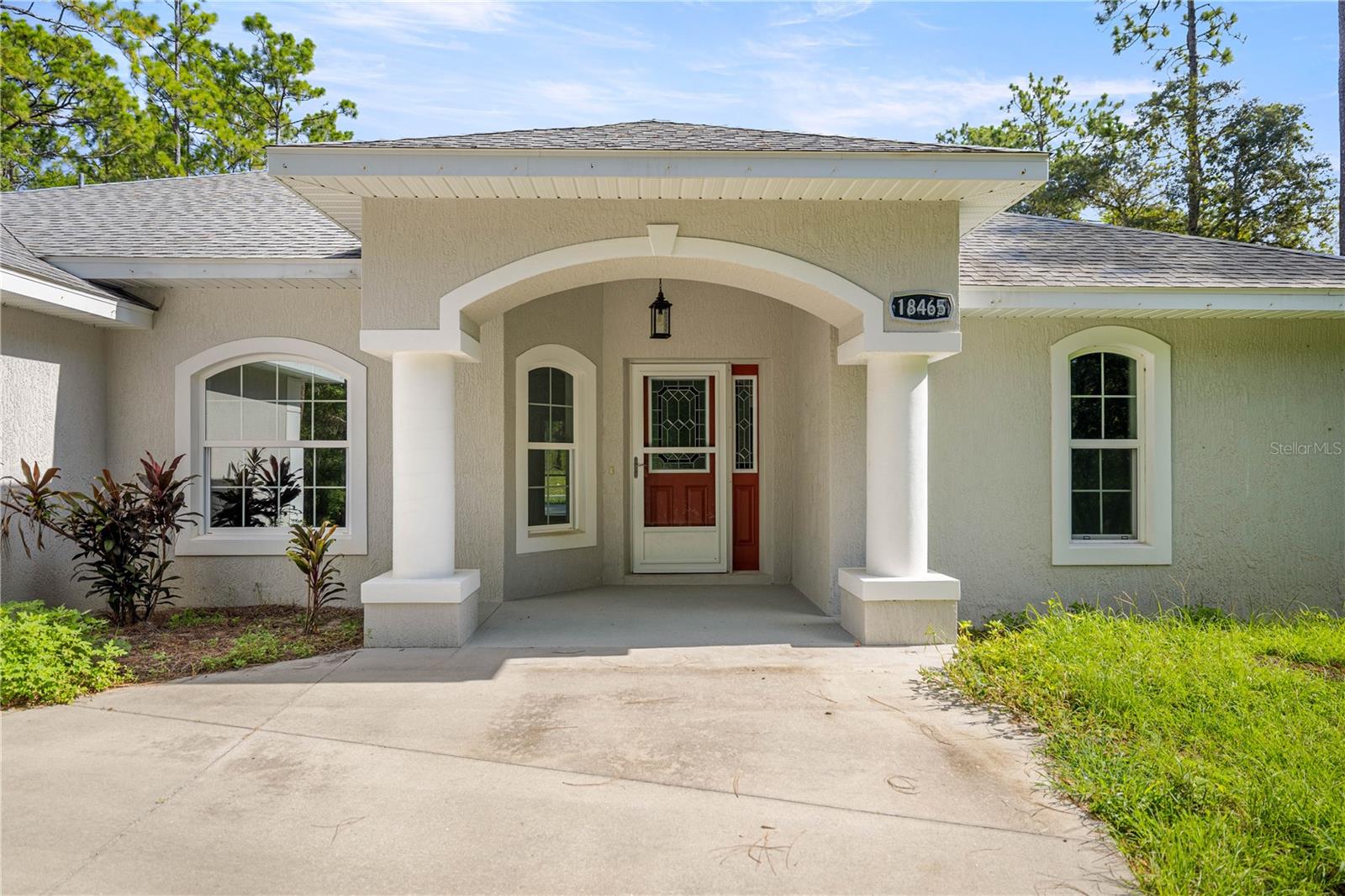 One or more photo(s) has been virtually staged. Here is the perfect opportunity to embrace the peacefulness of rural living while enjoying the small-town vibe of Dunnellon. This beautiful 2019-built home is nestled in the peaceful community of Lake Tropicana Ranchettes and sits on 2.43 acres of open countryside. This property offers space, freedom, and flexibility — all without the burden of an HOA or restrictions. Whether you're dreaming of bringing your horses or simply enjoying wide open space, this is the perfect place to call home.
This 3-bedroom, 2-bath residence features a split floor plan and an open concept design, ideal for comfortable living and entertaining. Step outside to your private in-ground pool and hot tub, enclosed in a large screened pool cage perfect for relaxing or hosting family and guests.
The spacious primary suite boasts sliding glass doors leading directly to the pool, dual walk-in closets, and a luxurious ensuite complete with two separate vanities and a generously sized walk-in shower.
With A2 zoning, bring your horses, hobbies, or homesteading dreams to life. Enjoy the quiet charm of country living just a short drive from shopping, dining, and outdoor recreation.
It is just a short drive to the quaint town of Dunnellon, 5 miles to the Rainbow River State Park where you will enjoy the crown jewel of Dunnellon, the breathtaking Rainbow River. You can play golf within a few miles at Juliette Falls, the World Equestrian Center is only 15 miles away and Ocala has plenty of shopping and dining within a 25 minute drive.
For the fishing enthusiast, enjoy Lake Rousseau for amazing bass fish and Crystal River, also know as the Nature Coast, is a 35 minute drive where you can enjoy fishing on the Gulf and seasonal scalloping. Doesn't this sound like the perfect mix for those seeking the blend of small-town charm, a slower place lifestyle and the beauty of natural landscape and nature every day. Call to schedule your appointment and make this amazing property your own!