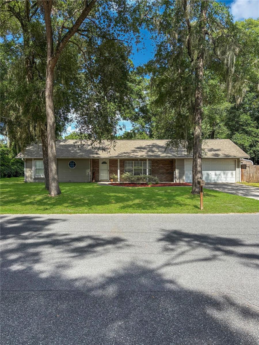 This home offers a large lot close to down town High Springs with no HOA. There is a large storage shed in the backyard with electric service. A portion of the garage has been turned into a room. It can be easily removed. The roof, hot water heater, and AC have all been recently replaced. Regardless, the home could use some TLC. It is priced accordingly. One could move in and fix it up along the way thereby building equity.