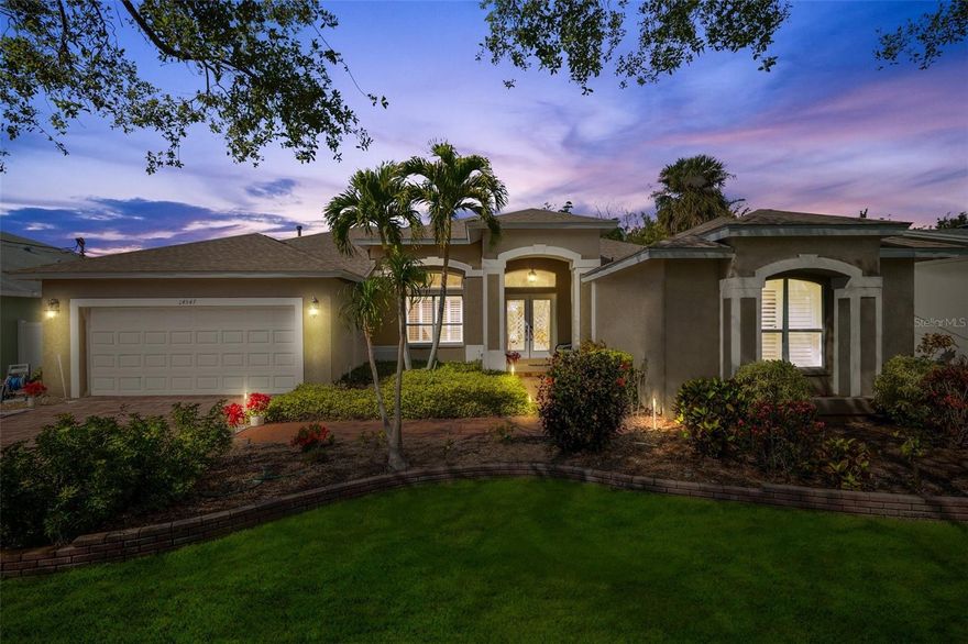 Welcome Home to 14547 Oliver Street!
This beautifully updated 3-bedroom, 2-bathroom home with a versatile bonus room off the Primary (ideal for an office, gym, or creative studio) is your private oasis in paradise!

Step through the leaded-glass door and take in the soaring ceilings, abundant natural light, and a BRAND NEW KITCHEN and APPLIANCES—complete with an impressive 9-foot island overlooking the sparkling pool. Fresh paint throughout, plush new luxury carpet and padding in the bedrooms, and a bonus room off the primary suite add comfort and flexibility to your living space.  Cabinet storage space is tremendous!

Recent upgrades include *new ceiling fans, toilets, the “B” side of the electrical panel, irrigation control box, gas hot water tank, and propane tank*.

Step outside to your tropical retreat—lush landscaping surrounds a dazzling pool and relaxing jacuzzi. Love to golf? You’ll be thrilled with your very own putting green, perfect for practicing your short game under the Florida sun.

Located just minutes from top-rated restaurants, Publix, Walsingham Park, the scenic Pinellas Trail, and best of all—Indian Rocks Beach is less than a mile away!

This home isn’t just a place to live—it’s a lifestyle.
Come fall in love with 14547 Oliver Street today!