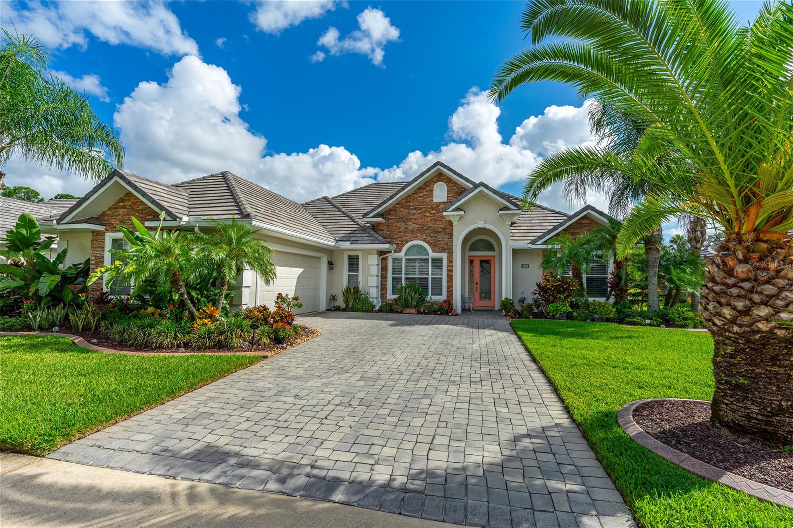 Discover paradise in the esteemed St. Regis enclave within Venetian Bay, where this impeccable waterfront home awaits a discerning buyer. Embrace leisure in this four-bedroom, three-bathroom masterpiece, designed for those who seek the finer things in life. From the moment you arrive, be captivated by the meticulous attention to detail: lush, upgraded landscaping with concrete curbing leads you to an elegant abode where tray ceilings, expanded crown molding, plantation shutters, Hunter Douglas custom window treatments and custom drapes frame serene views. The heart of the home, a chef's dream kitchen, featuring rich wood cabinets, top-of-the-line stainless steel appliances, a graceful tile backsplash, and lustrous granite counters. The primary bedroom suite offers a serene retreat, complete with direct access to the pool area, ensuring a seamless blend of indoor-outdoor living. The en-suite bathroom boasts a dual-sink vanity, separate tub and shower, and a spacious walk-in closet with an organizing system for the ultimate in luxury living.
Outside, the waterfront backdrop with fountain is accentuated by a custom-built, saltwater pool that is both heated and illuminated, completed in 2019 to provide year-round enjoyment. Nestled on a quiet cul-de-sac street and crowned with a tile roof, this home includes a laundry room, a safe room, an oversized two-car garage and a ready-to-serve generator, ensuring uninterrupted comfort and peace of mind.
Residents of this prestigious community enjoy access to a host of amenities including a spa, fitness center, charming eateries, and more. With proximity to pristine beaches, fine dining, exclusive shopping, medical facilities, and the excitement of The Daytona International Speedway, this home is more than a residenceit's a lifestyle. Indulge in the opulence you deserve.
AC 2022
Most furniture negotiable.
All information is intended to be accurate but cannot be guaranteed.