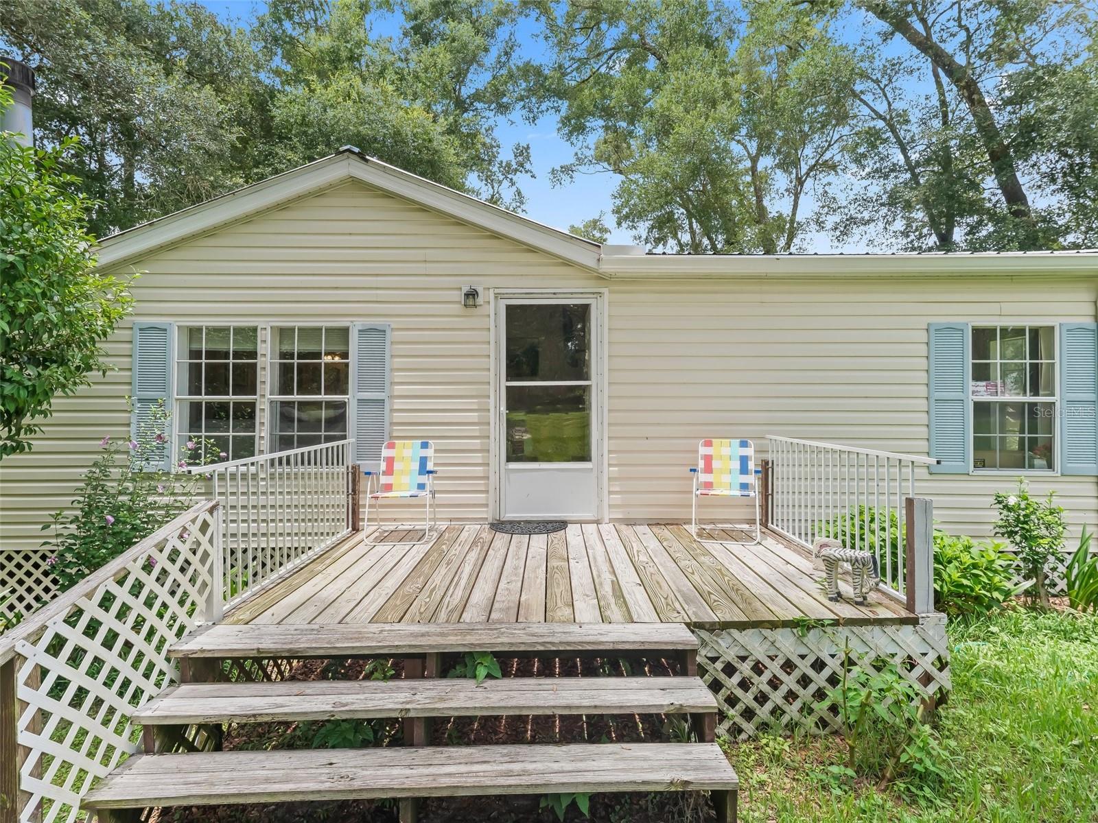 Escape to peaceful country living on your own acre of land just minutes from the Withlacoochee River. This well-kept mobile home offers peace of mind with a metal roof (installed in 2019), a new drain field this year, and a Leaf Filter gutter system with a transferable warranty. Inside, you’ll find a cozy kitchen with a built-in booth, perfect for morning coffee with a great view of your backyard pond. The split bedroom home is clean and ready for new owners to love it. The fireplace in the living room makes for a cozy setting, encouraging everyone to gather. Screened in back porch will be one of your favorite spots overlooking beautiful grounds. Out front is a shed, perfect for your gardening equipment and what nots. There are several public boat ramps close by, making those afternoon boat rides more possible without the "river front" price tag. Outside, enjoy colorful flowers blooming all around your yard — no flood zone, no HOA, just freedom to enjoy your space as you wish. Bring your boat, your toys, and your dreams — this slice of Florida is ready for you!