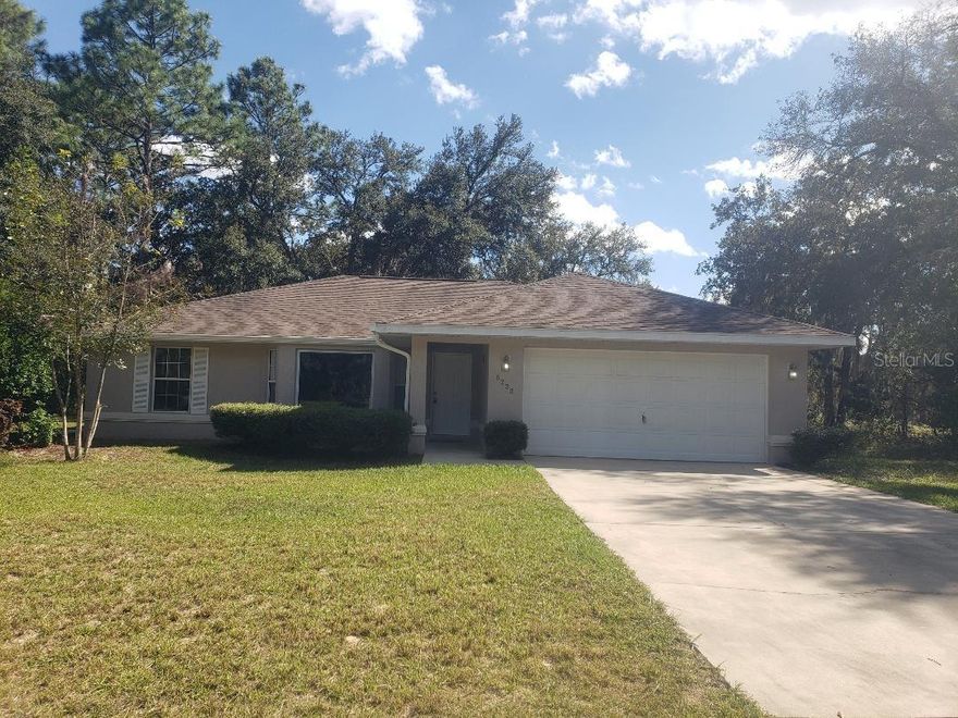 New carpet in this large 3 bed, 2 bath home in Marion Oaks.  Covered patio area in back of home.  New appliances in kitchen.  Newer tiled walk in shower in primary bath.