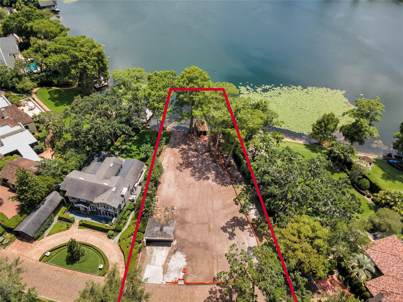 Beautiful and secluded lakefront lot on quiet cove on Lake Osceola. Opportunity to design and Build with Z Properties.