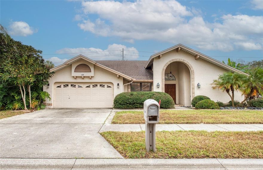 You don’t have to spend millions to enjoy the beauty and charm of Safety Harbor! This delightful 3-bedroom, 2-bath home is perfectly located just a short stroll from the sparkling waters of Tampa Bay—yet safely outside the flood zone. Enjoy the convenience of walking to the world-renowned Safety Harbor Spa and the vibrant dining and shopping scene on Main Street. 
Step inside to discover an open, split floor plan with custom tile flooring throughout and plantation shutters on every window and door. The spacious kitchen features granite countertops and a walk-in pantry, perfect for home chefs. The large great room is anchored by a cozy, wood-burning fireplace—ideal for relaxing evenings.   
Step outside to your private tropical oasis, complete with a screened saltwater pool and lush landscaping, including your very own banana tree! This golf cart-friendly community has a low HOA and is just minutes from Tampa International Airport, Clearwater Beach, Dunedin, and Tarpon Springs Don’t miss your chance to own a piece of paradise in one of Florida’s most charming towns!