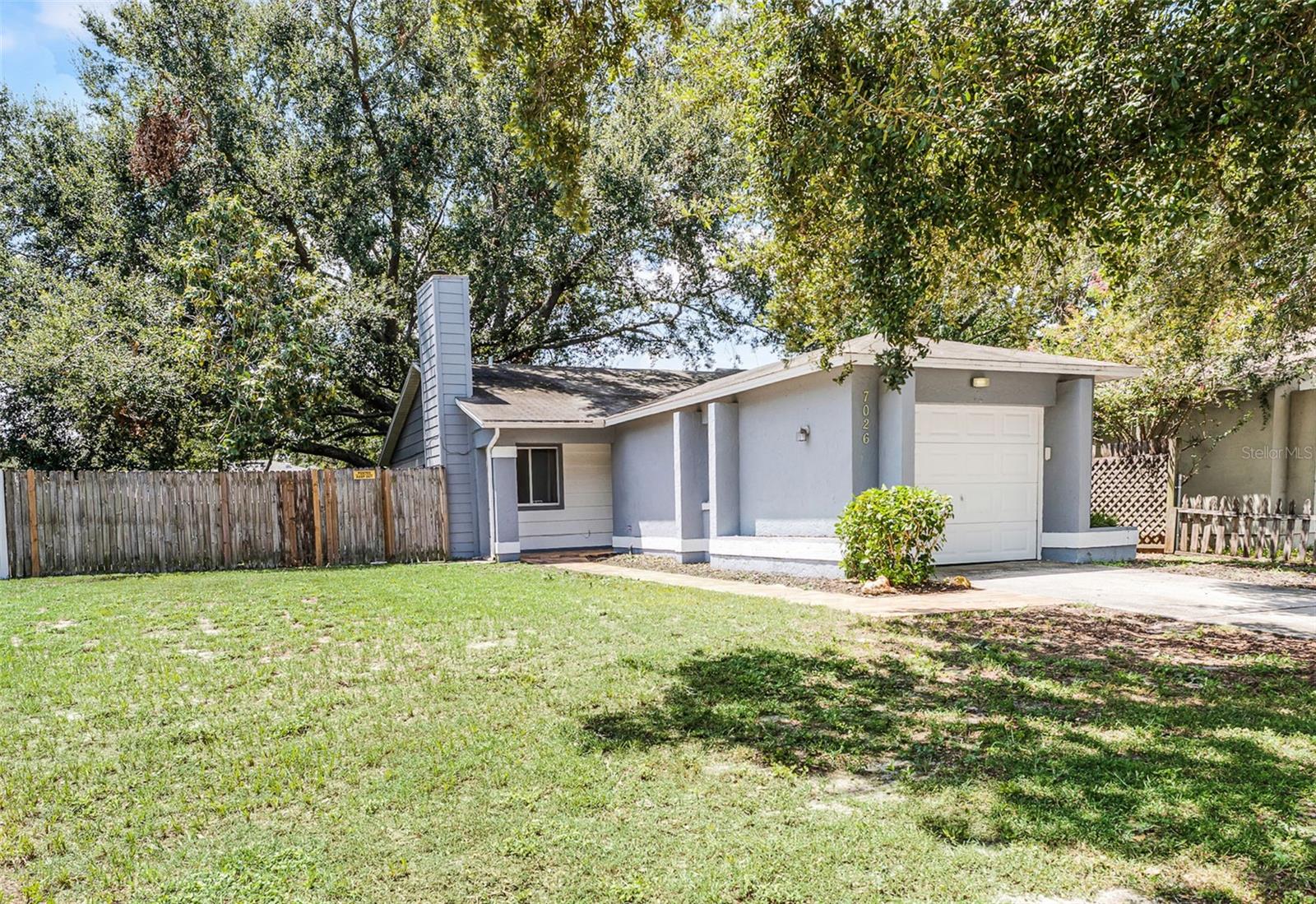 Location! Price! Location! A Rare find in this super clean home ready to move in at the price you have been looking for with NO HOA! Kitchen features updated cabinets, granite counters along with stainless steel appliances. Spacious family room with brick fireplace and dining area with ceramic tile. Updated master bath has newer vanity and floor to ceiling tile in the shower with frameless glass door. No carpet and updated lighting fixtures and ceiling fans complete the interior. New HVAC in 2023. Huge yard with extended decking perfect for grilling and or a patio table and chairs. The gorgeous oak tree can keep the home shaded and can keep your AC bill lower than average. Fully fenced on all sides for additional privacy. All this plus a single car garage. Location benefits include easy access to SR 408, SR 429, Florida Turnpike, Downtown Orlando, Downtown Winter Garden and so much more!