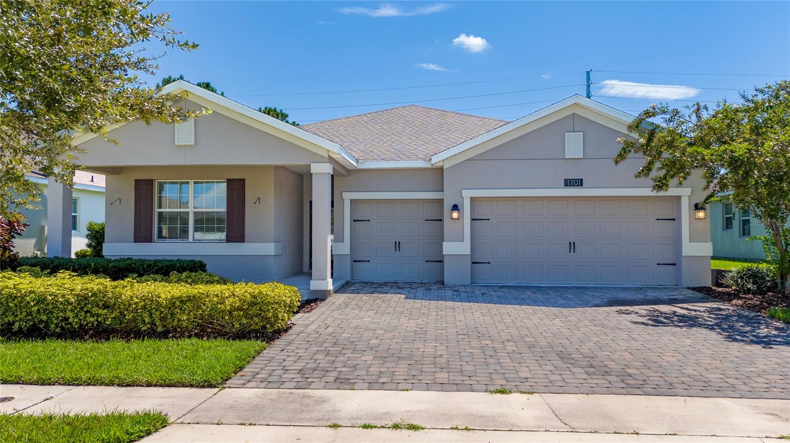 Discover thoughtful design and functional living in this charming four-bedroom, three-bathroom home. Just minutes from all Saint Cloud and Lake Nona have to offer. Come check out this home featuring 2,398 square feet of warm, inviting space designed for the moments that matter most. Large kitchen with island features 2 year old Stainless Steel appliances, quartz countertops and 36" Espresso Cabinets. This kitchen easily transitions from cozy dinners in the nook to hosting a gathering with friends. The spacious primary bedroom serves as your private sanctuary, a peaceful retreat where you can unwind after busy days. Your private En-Suite bathroom has dual sinks, a spacious and tiled shower and a soaking tub to relax in after long days. Three additional bedrooms provide perfect spaces for an office, playroom, or guests to feel welcome in. With three full bathrooms, even the busiest morning routines become seamless, giving everyone space to prepare for the day ahead. The front bedroom also offers the privacy of an En-Suite bath. Front balcony is perfect for rocking chairs. The Saint Cloud location keeps life's conveniences within easy reach. Schools, Grocery, Banks, post offices, restaurants and modern conveniences are just over a mile away. When adventure calls, Lake Runnymede Conservation Area beckons with peaceful walking trails and natural beauty perfect for picnics and quiet reflection. Low HOA and No rear neighbors.
