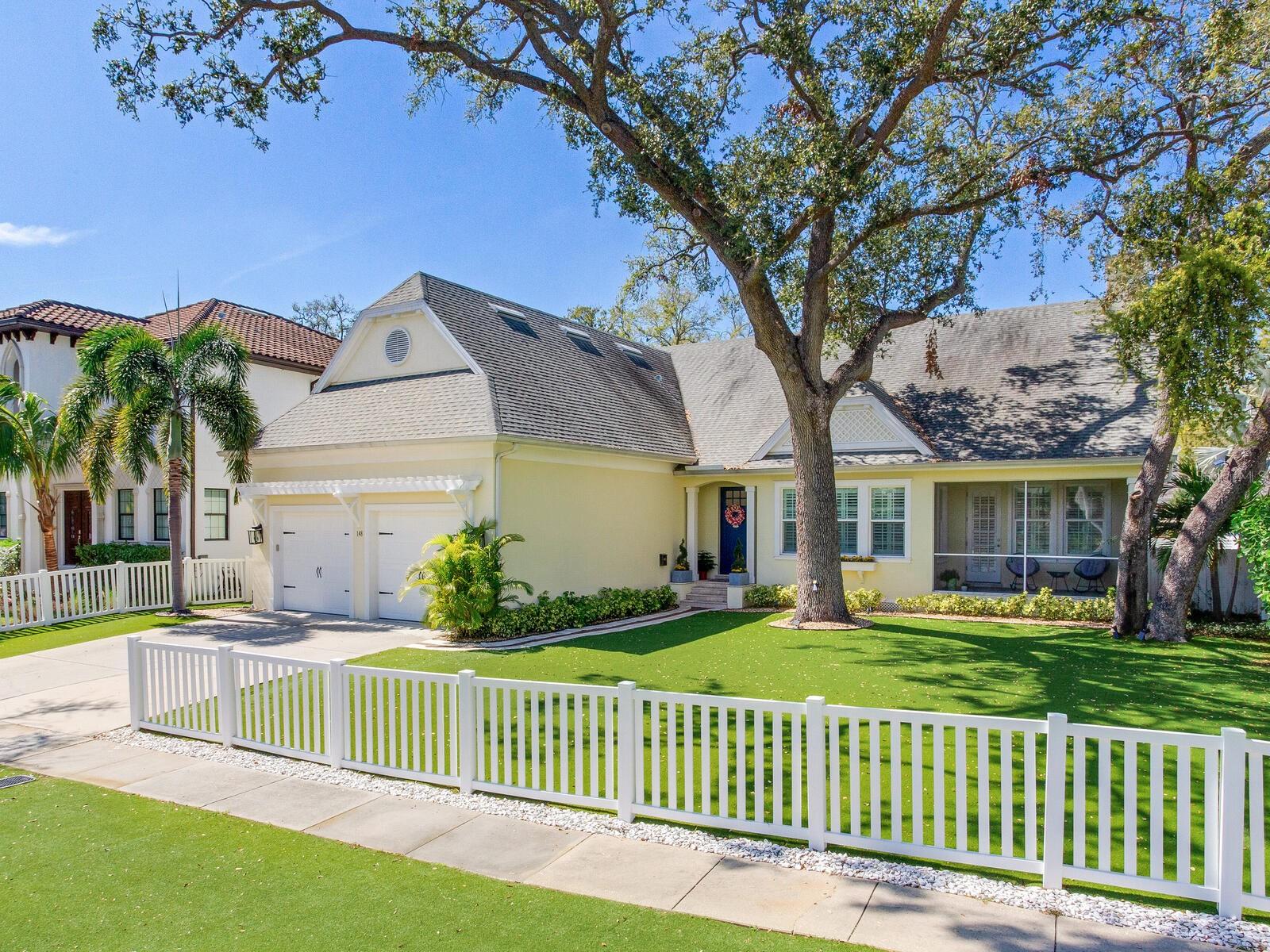 Having a house on Davis Island is very convenient and the most special mix-use place in Tampa! This community sits across the channel from Harbor Island and is minutes over a bridge to Downtown Tampa. It is sought after for two reasons…one, its proximity to Bayshore, Hyde Park, Downtown, interstates, shops, fabulous Tampa schools, churches, and shopping. Secondly, it’s easy to travel to the white sandy beaches of the Gulf and just a mere 1.5 hours to Disney and other Orlando theme parks. The main reason a Davis Island address is so desirable is that it’s a small community with its own banks, fire department, hospital, doctors and lawyers’ business offices, restaurants, drug stores, post offices and unique boutique-style shopping. Additional community features are the tennis club, garden club, two marinas, a small beach, dog water park, two parks for residents, a center pool for residents, baseball fields and a private airport. Residents feel free to ride around on golf carts and all the streets have sidewalks. It's very special to have a home in this community.
This is the most adorable home on Davis Island…it’s turnkey and ready for a couple with children or a downsizing family. The primary and two bedrooms are downstairs and the home features an entire apartment upstairs. Upon entering the home, a two-story, great room highlighted by a vaulted ceiling is immediately viewed and exudes a breath-taking “Ah!” The great room is open to a state-of-the-art kitchen with white matching stone and the cabinets are solid wood with two glass accents. The dining room is also open to the great room, adjacent to the beautiful bank of windows, a large table, and chair grouping which is perfect for this space. The second floor is amazing with another large primary, quality bedroom and a bath and a vaulted ceiling, large bonus living room, kitchenette and gym/playroom. This home is so over the top value for the price and did not flood during any storm. The backyard is perfect with a pool, outdoor kitchen, patio living room, and pool bath. The back yard is also fenced-in cement and has a screen enclosure. The front yard is enclosed with a charming white picket fence. One of the best features is that the yard is a no-mess and no mowing needed… it is all astroturf. This 4 bedroom 3.5 bath home (one being a Jack and Jill) Davis Island home is not to be missed. You must see!