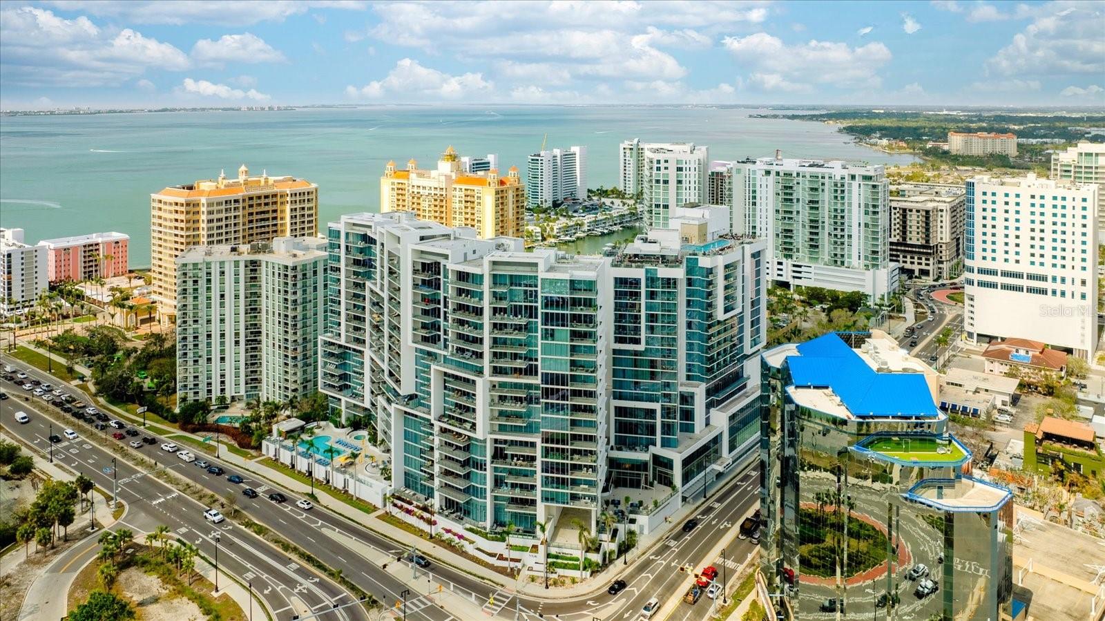 An Elevated Coastal Retreat in the Heart of Sarasota
Experience the extraordinary waterfront lifestyle of downtown Sarasota in this refined residence at The Vue—where panoramic views, contemporary elegance, and thoughtful design meet in perfect harmony.
Graced with over 2,380 square feet of sophisticated living space, this 3-bedroom, 3-bath residence is a true sanctuary in the sky. Located on the 17th floor, soaring 11-foot ceilings and dramatic floor-to-ceiling windows invite abundant natural light and frame captivating vistas of Sarasota Bay, the city skyline, and beyond.
Step inside the residence from your private elevator and discover a generous great room designed for relaxed luxury. The gourmet kitchen is a dream for both chefs and entertainers alike, featuring a quartz-topped island, custom cabinetry, a built-in 280-bottle wine fridge, top-tier appliances and a spacious walk-in pantry.
Wake up to breathtaking views from the serene primary suite, complete with a spa-style bath and a custom walk-in closet. The second bedroom also offers water views, an en-suite bathroom, and a generous walk-in closet. The third bedroom, currently styled as a home office with custom built-ins, offers flexibility to accommodate additional guests with ease.
This residence also includes a premium upgraded A/C system, 2 under-building parking spaces, and a secure, climate-controlled storage.
At The Vue, enjoy resort-style amenities curated for your comfort: 24-hour concierge service, valet parking, a state-of-the-art fitness center, stylish club lounge, private boardroom, and inviting social spaces for hosting friends and guests. Professional on-site management ensures your every need is met with care and discretion.
Located adjacent to The Westin and The Ritz-Carlton, and just minutes from the white sands of Lido Beach, St. Armands Circle, and Sarasota’s private airport terminals, this exceptional property offers a rare opportunity to enjoy the very best of Florida’s Gulf Coast—whether as a full-time home or a sophisticated seasonal retreat.