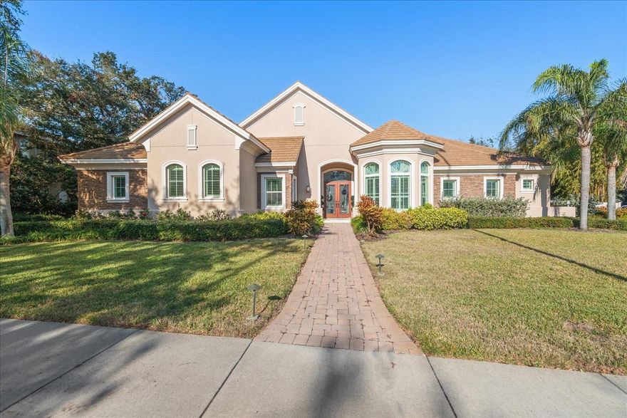 Welcome to this beautiful home located in the heart of Belleair. It has been custom designed with state-of-the-art innovation to create a sense of openness, comfort and sophistication. The builder finished to the finest detail, this custom home is truly one of a kind. Built by famous custom home and green builder, Marc Rutenberg. This home combines sustainable green technology, Five Star rated energy efficiency powered by solar energy with an amazing design that will appeal to a all potential homeowners. The living spaces make a stylish statement with tall ceilings and a cozy inviting feeling. The open kithcen features custom birch cabinetry, stainless steel appliances, granite counters and a large island that is perfect for casual dining. The spacious living room right off of the kitchen is suitable for large families and entertaining. The oversized primary suite is sure to impress with its large walk-in closet and spa-like bathroom. For up-to-date work-from-home life, there is a spacious home office. Transition outside to a huge patio overlooking a natural gas heated salt-water pool and spa that is perfect for entertaining. No details were overlooked in the construction of this home, from an aesthetically pleasing design to top-of-the-line security and safety features implemented to withstand tropical weather, including all-block construction, PGT hurricane windows, doors and a 27 KW commercial grade generator to power the entire house. Home even comes complete with a side-drive, 3 car garage. Custom construction coupled with amenities make this home a must-see for all.