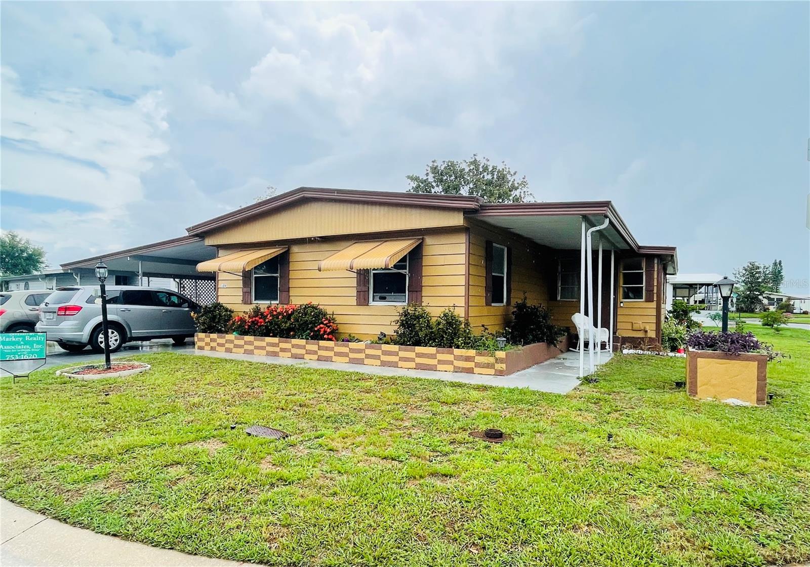 Great community that is all ages and pet friendly. Home has woodlike laminate flooring, upgraded cabinets and counters in the kitchen.Large living room and extra den/media room. There is an enclosed Florida room that just needs some finishing touches to make it a great craft area or office. Large screened in porch.Great location just minutes from I-75 and shopping. Community offers a large clubhouse and pool.