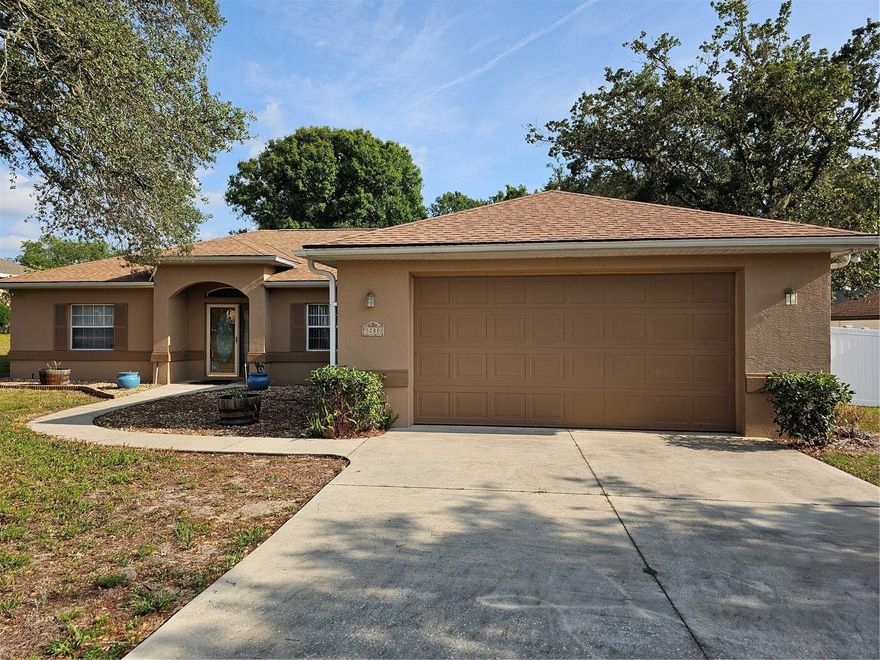 Come home to this beautiful, tranquil neighborhood. Enjoy the spaciousness of the high vaulted ceilings of this light & bright home. New roof installed 11/2023. Newer Stainless Steel GE Appliances. Main of house has large Porcelain tile. Nice light fixtures. All Kohler toilets & sink faucets in bathrooms. The split floorplan provides comfort & functionality. The large Great room offers ease of entertaining & an expansive feeling of openness. The Primary/ Master Suite has an ensuite bathroom & very large walk-in closet. Relax in the huge, comfortable Garden Tub. Walk-in shower with tile & clear door and top area allows ease of access & plenty of light. The dining area has plenty of room for a very large table. Oversized garage will allow a Suburban to park in there. Side door, to walk into the garage, is convenient. The newer Vinyl fence provides privacy & a safe place for pets to play. The single gate allows a 60 inch wide mower to drive through. The double gates on the other side will allow vehicles to drive though, in case a pool is ever to be installed. The yard has an irrigation system. The screened porch is great for grilling or just enjoying nature. There are Japanese Plum trees (Loquats) that produce fruit, young Tangerine trees & Turk's Cap Flowers in the back yard. The home is well maintained. Convenient location to everything!