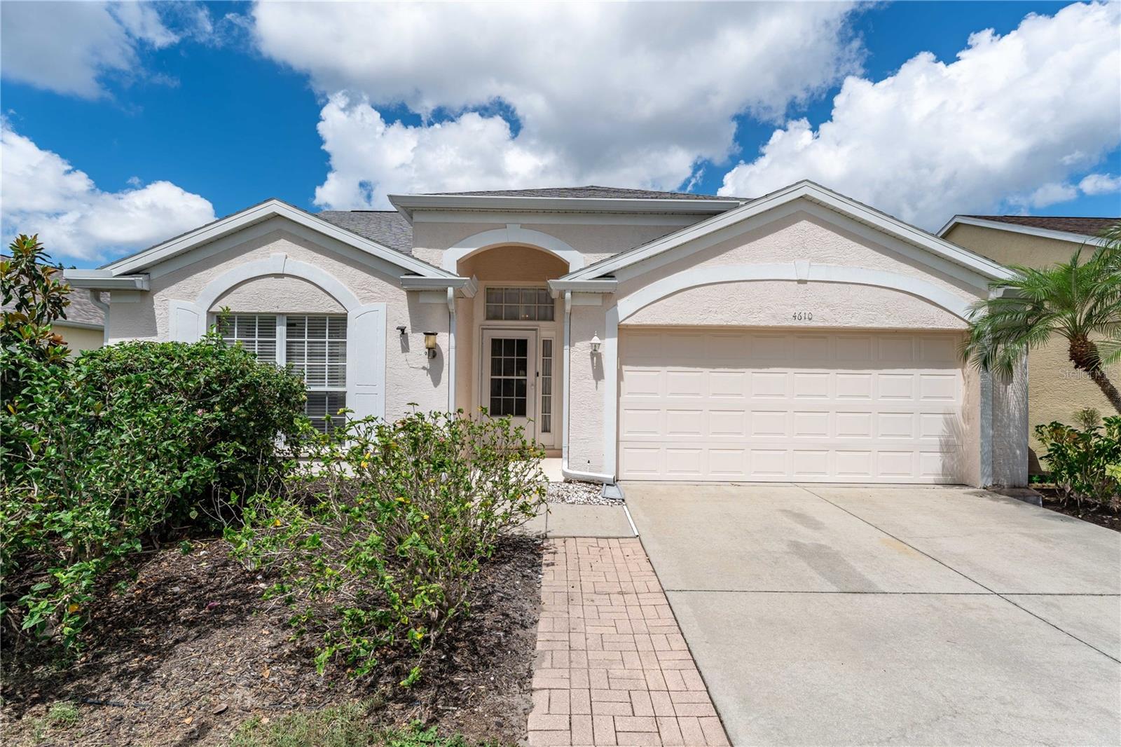 Welcome to this beautifully maintained 3 bedroom, 2 bath home nestled in the highly sought after Sabal Harbour Community centrally located between US 301 and I-75 just north of SR 70. *** Built in 2001 and thoughtfully updated, this home offers comfort, space, and scenic surroundings at an exceptional value. Step inside past the entryway to the open-concept L-shaped living and dining rooms, filled with natural light and enhanced by soaring cathedral ceilings. The spacious kitchen features a breakfast bar that seamlessly connects to the living and dining spaces – perfect for everyday living and entertaining. The large primary suite offers a peaceful retreat, complete with a walk-in closet, double vanity, walk-in shower, and private water closet. Two additional bedrooms and a full bathroom provide plenty of room for family, guests, or a home office. Enjoy Florida living at its best with an expansive screened lanai overlooking a tranquil pond – ideal for morning coffee or evening relaxation. ***Key features: New roof (2022), New HVAC (2022), water heater (2022), washer and dryer bought in 2022 included, 2 car garage, spacious lanai with pond view, Low HOA fee: $69/month. *** Community amenities: Very large heated community swimming pool, flood-lit tennis and pickleball courts, basketball court, and playground *** Don’t miss this opportunity to own a move-in ready home in a quiet neighborhood with easy access to shopping, dining, schools, and Gulf beaches. Note: entry to Sabal Harbour is off of 45th street, and is north of entrance to Sabal Key. Schedule your private showing today!