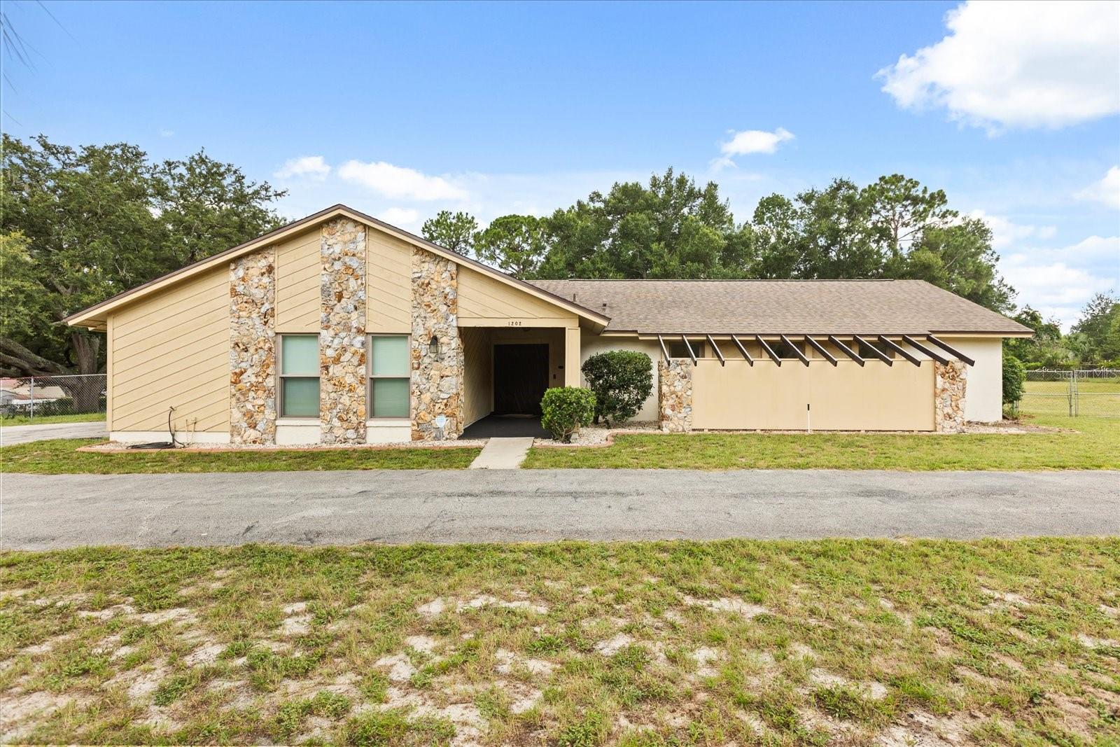 Located at the end of a quiet cul-de-sac in the Markham Woods corridor, 1202 Kumquat Ct offers a rare opportunity with over an acre of flat, dry land—ideal for future additions like a pool, barn, or workshop. With no HOA, the flexibility here is unmatched.
This thoughtfully designed home features a split floor plan perfect for multigenerational living or large families. One wing includes the primary bedroom with an attached office, private bathroom, and its own living space. The opposite side of the home features three additional bedrooms and a second full bathroom, offering space and privacy for everyone.
Recent updates include a 1-year-old AC system, new double-pane windows and sliding doors, and a recently replaced roof. The home has also been freshly painted inside with popcorn ceilings removed, giving you a clean slate to personalize and update the interior to your taste.
Enjoy direct access to the Seminole Wekiva Trail, top-rated Seminole County schools, and a location that offers the perfect blend of natural beauty, convenience, and potential. If you’ve been searching for a home with space, flexibility, and future possibilities—this one checks all the boxes.
<iframe src="https://www.zillow.com/view-imx/b475cea5-425e-4369-9a09-007c3d7695c6?setAttribution=mls&wl=true&initialViewType=pano&utm_source=dashboard" width="100%" height="790px" frameBorder="0" style="border: 0;"></iframe><br>Brought to you by <a href="" target="_blank">The A List</a>