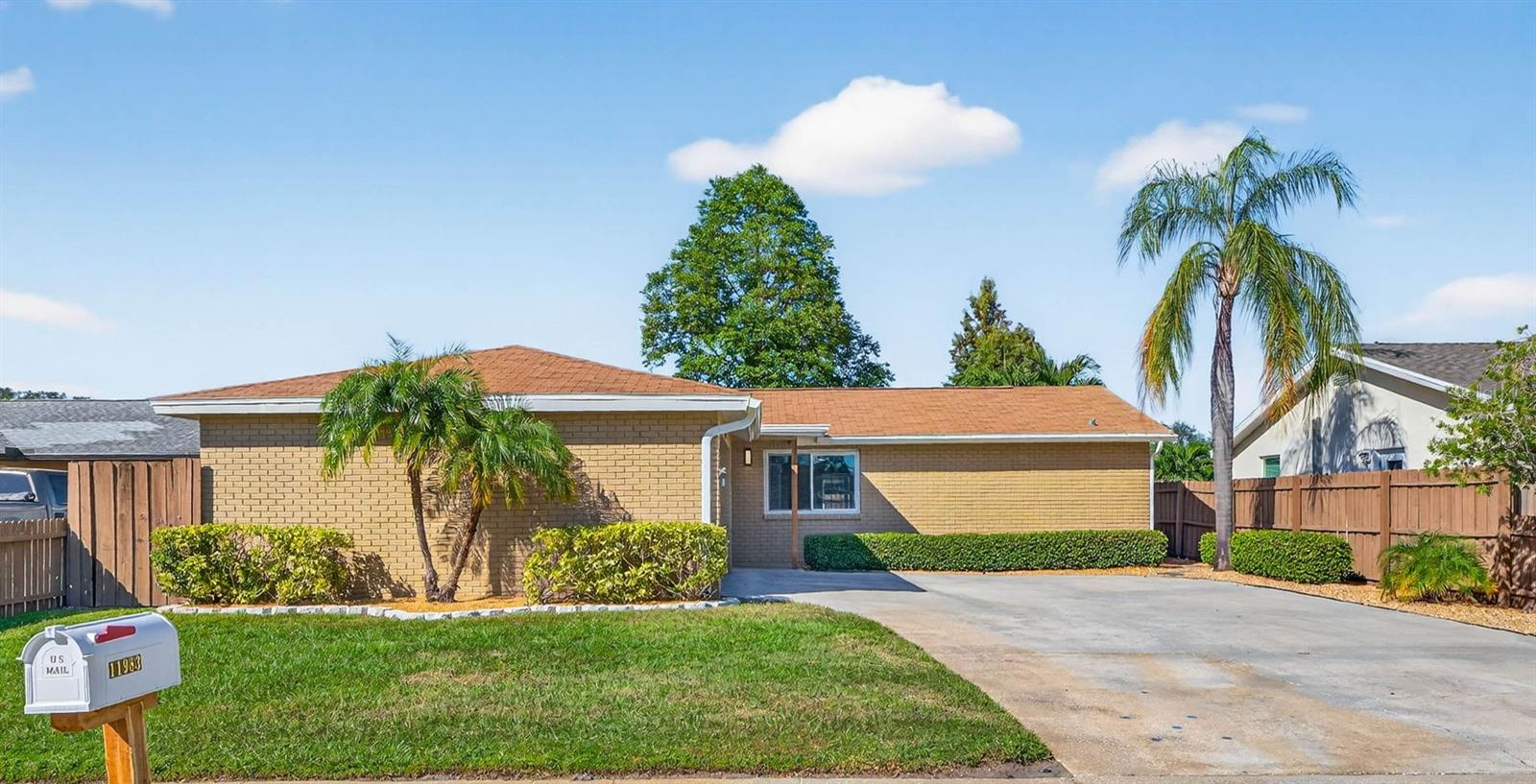 **Stunning Move-In Ready Pool Home!** This beautifully updated 3-bedroom, 2-bath home offers the perfect blend of style and comfort. Step inside to an open, split floor plan featuring a spacious living area with luxury vinyl plank flooring natural light. The modern kitchen and bathrooms have been tastefully updated, and brand-new carpet adds comfort to all bedrooms. Enjoy peace of mind with a newer roof (2020), hurricane-impact windows, and low-maintenance landscaping. Relax or entertain in the enclosed lanai overlooking your private pool. The two-car garage features a sleek epoxy floor finish. Conveniently located near top schools, shopping, dining, and just minutes from the Gulf beaches — this home truly has it all!