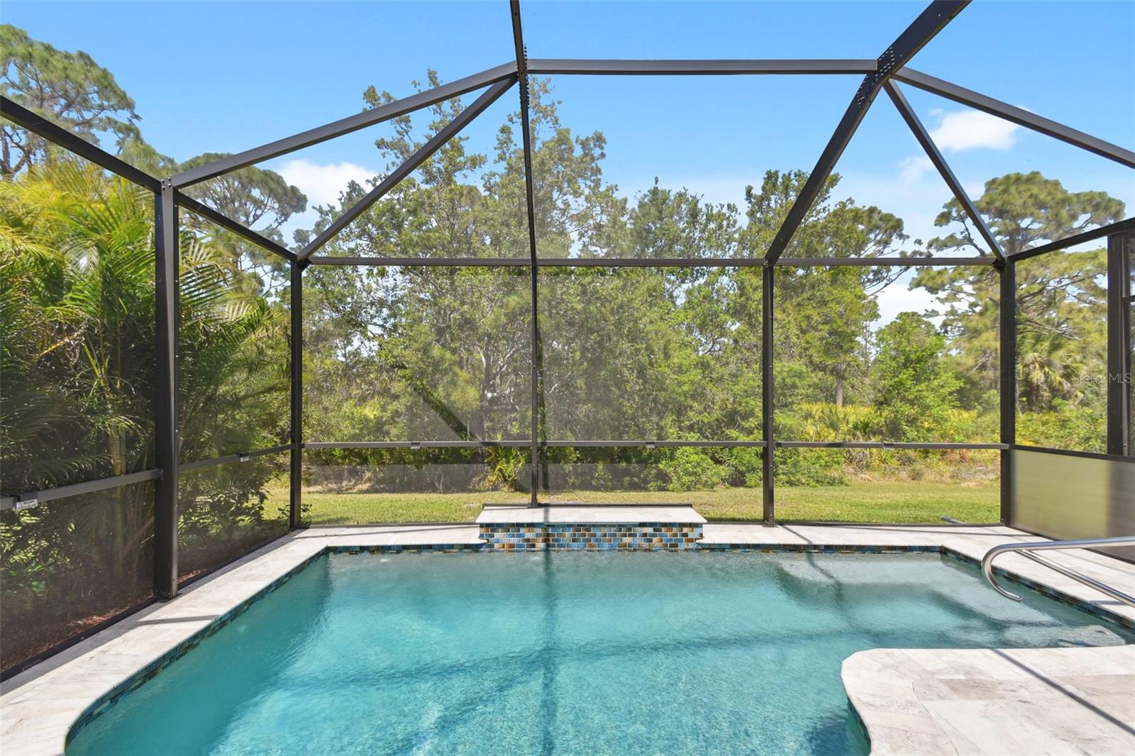 Don't miss this Private Pool Villa! SELLER now offering a $10,000 credit to buy down the interest rate OR for a price adjustment with an accepted offer by August 15,2025. This is the ONLY private pool villa currently available in Gran Paradiso, a spacious 2 bedroom + den -2 bath villa which features upwards of 94K in upgrades in addition to an open-concept layout. granite counters, stainless steel appliances, and a luxurious primary suite with dual closets and a walk-in shower. Step outside to your private screened heated saltwater pool and lanai- perfect for year-round relaxation with NO Backyard Neighbors! Live maintenance free with HOA covering landscaping, cable, internet, and access to resort-style amenities: clubhouse, tennis, pickleball, pool, fitness center and more. Just 15 minutes to Manasota Key Beach and close to Wellen Park, Cool Today Baseball Stadium, dining and shopping. Easy to schedule a showing- seller is ready to negotiate