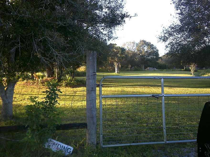 ~Dixie Ranch Acres~ Beautiful property ready to build your new home. Homes only neighborhood. Completely fenced, has a gated entrance. 1.5+/- Acres with scattered trees, has a pond. the property is at the end of the road. Call for information!!