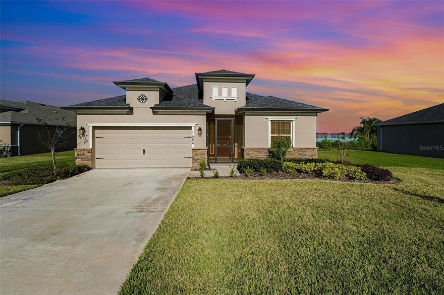 Set on a rare quarter-acre lake-view homesite, this newly built 2024 residence by Clayton Properties Group offers the advantage of modern construction without the wait, paired with a serene Lake Alfred setting. Designed for both comfort and functionality, this single-story layout spans 1,938 square feet and centers around an open-concept living space that seamlessly connects the kitchen, dining area, and family room. The kitchen is thoughtfully appointed with Silestone countertops, stainless steel appliances, a pantry, and a counter-height island that anchors the home's social core. The primary suite is privately positioned and features a walk-in closet and an en-suite bath with dual vanities, a tiled shower, and a separate water closet. Two additional bedrooms share a pass-through bathroom, while a dedicated office provides flexibility for remote work or additional living space. Vinyl Plank flooring extends throughout the entire home, enhancing durability, continuity, and ease of maintenance. A covered patio extends the living space outdoors, offering peaceful lake views and a natural backdrop. Additional features include a screened front entry, a two-car garage, custom-fit window blinds, architectural shingles, and upgraded electric car outlet. Ring Doorbell Camera conveys with the property. Located within an HOA community and conveniently to local lakes, everyday amenities, and regional access to Winter Haven, Orlando, and Tampa, this move-in-ready home presents an exceptional
opportunity for modern Central Florida living.