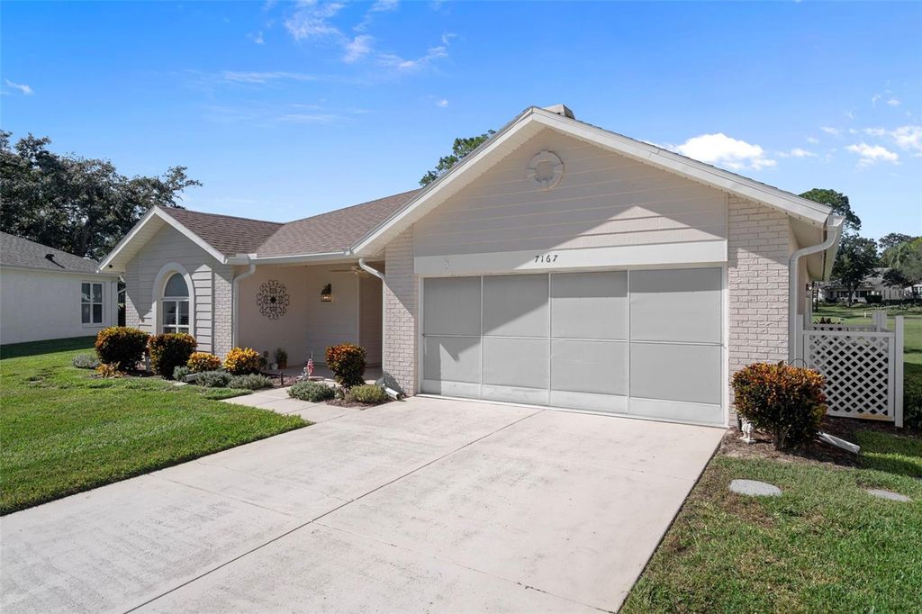 Photo of 7167 Crown Oaks Drive, Spring Hill, FL 34606 (MLS # TB8507409)