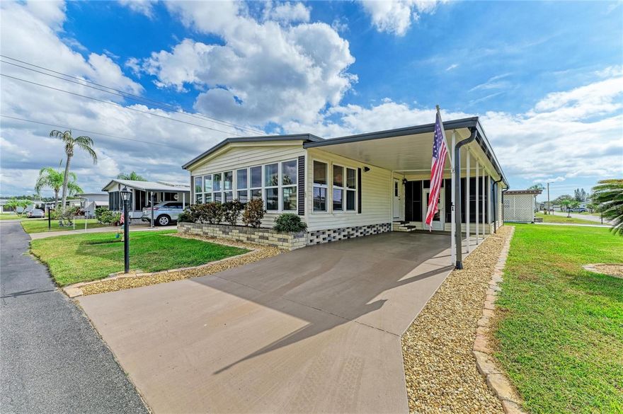 SHOWS LIKE A MODEL HOME. A TRUE GEM AND A MUST SEE! COMPLETELY UPDATED AND FURNISHED. Welcome to Westwind Village, a warm and welcoming 55+ resident-owned community in beautiful Bradenton, Florida — just 14 miles from world-renowned Gulf beaches! This charming home sits on a well-maintained corner lot with lush landscaping and in-ground irrigation, offering easy access to the community pool and clubhouse. Step inside and fall in love with the open-concept layout that blends the kitchen, dining, and living areas into one bright and inviting space. The home has been elegantly updated and meticulously maintained, featuring luxury vinyl flooring, fresh exterior paint, and modern accent lighting throughout. The brand-new kitchen showcases stainless steel appliances, a built-in microwave above the range, and stylish finishes that make cooking a pleasure. Both bathrooms have been completely remodeled with matching vanities, large mirrors, and stunning light fixtures that add a touch of sophistication. The primary suite offers vibrant colors, custom barn doors, and a walk-in closet measuring 6’5” x 6’2” (approx.). The guest bedroom also includes a spacious walk-in closet for additional storage. Just off the main living area, you’ll find a 12’ x 23’ (approx.) Florida room filled with natural light — perfect for relaxing, reading, or entertaining guests. Outside, the enclosed lanai features large windows, window shades, and a ceiling fan for year-round comfort. It connects directly to the utility workshop, complete with washer, dryer, mud sink, workbench, and extra shelving for projects and storage. A rear concrete patio provides the ideal spot for outdoor barbecues or morning coffee in the Florida sunshine. This home is being sold fully furnished (with the exception of a few personal items), making it move-in ready and perfect for a second home, winter retreat, or relocation property — just bring your suitcase! Community amenities include a beautiful clubhouse with enclosed lanai, swimming pool, billiards room, library, shuffleboard courts, on-site laundry, and a fully equipped industrial kitchen — a wonderful space for social events, parties, and gatherings. Residents of Westwind Village enjoy a friendly, active lifestyle with pancake breakfasts, card games, exercise classes, Bible studies, travel groups, and holiday dinners. It’s a place where neighbors truly become friends. The low monthly HOA fee covers lawn care, water, trash pickup, cable, internet, and use of all community amenities — plus, the purchase price includes ownership of a community share (not lot rent!). Experience Florida living at it's best — affordable, maintenance-free, and full of life. Westwind Village is more than a place to live; it’s a community you’ll love calling home.