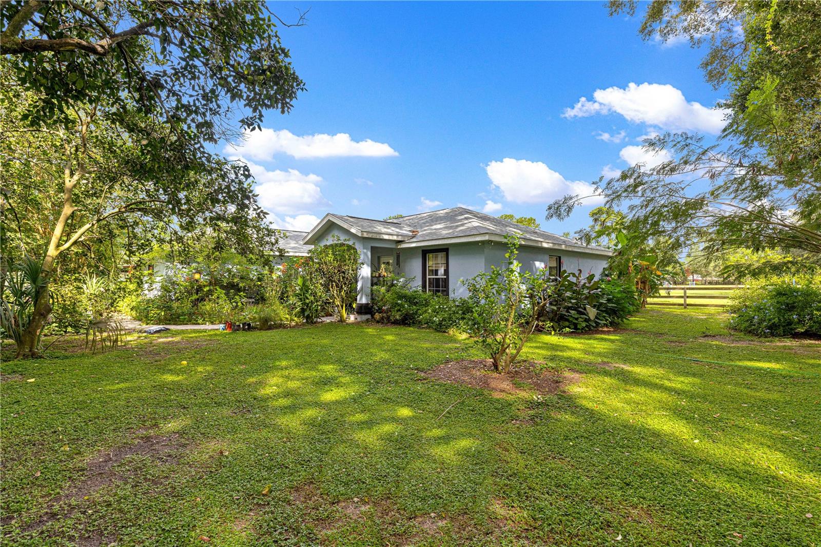 Welcome to this beautiful 3 bedroom, 2 bathroom pool home nestled on almost 5 acres. Perfectly suited for equestrian living. Just 20 minutes from Florida horse park and the riding trails. Only 35 minutes from the world equestrian center! This property offers a rare combination of comfort, functionality, and country charm. The home features a spacious layout ideal for both everyday living and entertaining, with a beautiful pool providing a relaxing retreat. This property includes five well-maintained paddocks, two barns, and a total of seven stalls. This is an ideal setting for those seeking a peaceful lifestyle with convenient access to equestrian amenities.