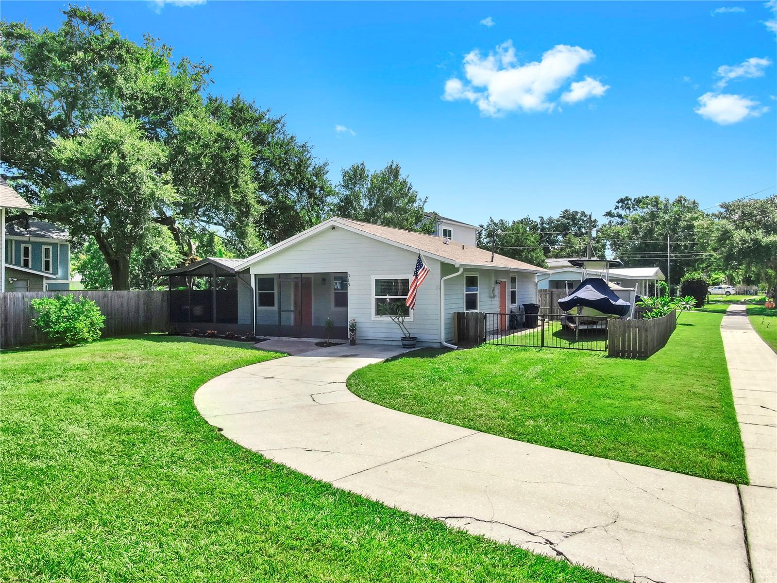 This charming single-family home, 1133sqft, nestled in the historic district of Oldsmar, features three bedrooms and two bathrooms, including a master bedroom with an en-suite bathroom. The property has never experienced flooding or flood damage, offering peace of mind. Recently updated in July 2025 with a new roof and insulation, the home also has vinyl windows, fresh paint, and updated exterior siding. Bathed in natural light, it includes an inside laundry room, a hardwired security system that stays with the home, and ample storage with sheds and boat parking. The yard is adorned with a lemon tree and an orange tree, adding a touch of nature. Just a short stroll to Centennial Park, RE Olds Park, and Mobley Beach Park, this home is only a 30-minute drive from Tampa International Airport and Honeymoon Island. Schedule your showing to experience this move-in-ready gem today.
