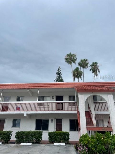 REDUCED!!! SELLER SAYS "SELL" THIS ONE BEDROOM CONDO AT ORCHID SPRINGS VILLAGE, A TRANQUIL 55+ COMMUNITY, HAS GREAT VIEWS OF MATURE LANDSCAPING - TROPICAL, QUIET & PEACEFUL! Close proximity to shopping, medical, US Hwy 27 and I-4! Charming 1 bedroom 1.5 bath second floor residence, a great place to call home! Water, sewer, trash, natural gas, grounds upkeep and assigned parking space are included in the monthly association fee. One pet allowed with pet approval that meets the HOA restrictions on size and breed. Buyer approval required by the HOA.
