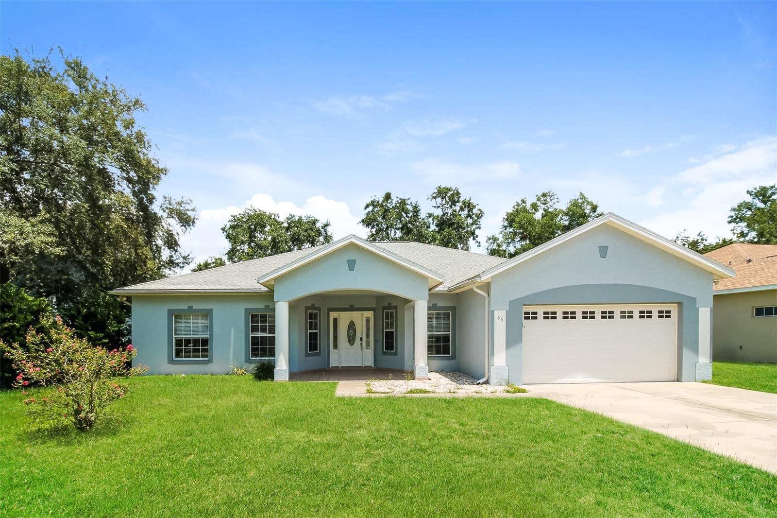 Charm and curb appeal abound for this Ocala home! Step inside into the inviting foyer and through into the family room, which sits at the center of the home. The kitchen boasts stainless steel appliances, hard surface countertops, ample storage, and access to two seating areas. This split floorplan offers the primary suite on one side of the home and three secondary bedrooms along with a laundry room. Enjoy your covered patio all year long! Come and see for yourself the possibilities that this home has to offer!