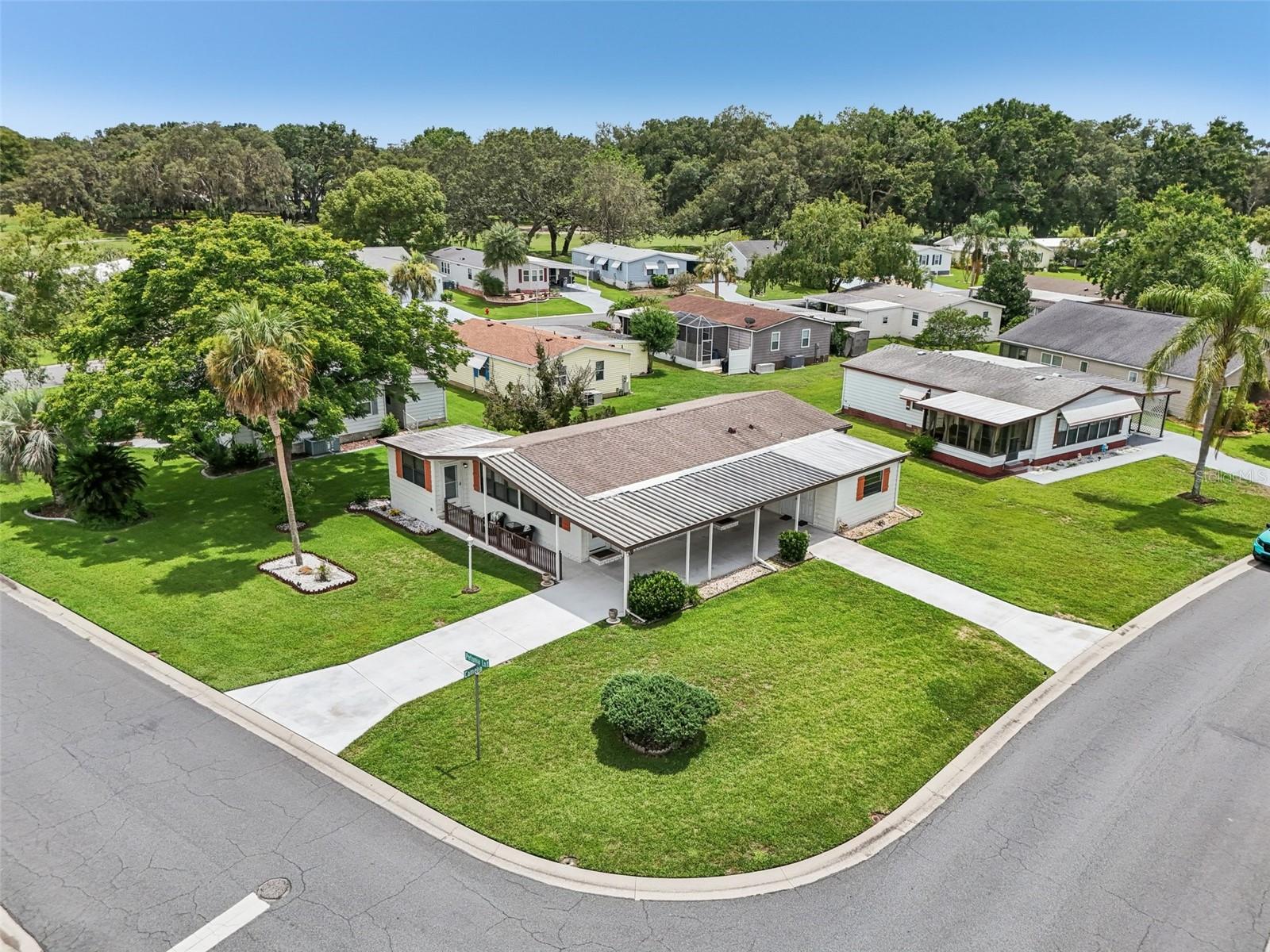 No BOND, Turnkey, 2 Bedroom 2 Bath Model 6A with a Bonus Room as a Bedroom, an Office, or Other, Open Floor Plan, Kitchen Island, on a Corner Lot, and a Family Room/Game Room in addition to a Living Room home ready for You. At 1434 SF this home has Size and Room. The Bonus Room is not counted in the square footage as there is a step down and sliding glass doors. Carport has room for 2 vehicles and there is a Golf Cart Garage. Plenty of Driveway for parking your friends off the street and a great entertainment home for friends and family. There is even a Wet Bar in the Family/Game Room. Situated on a large corner lot and very near all the amenities that being a Villager provides like restaurants, Adult Pools, Hilltop Country Club, Golf, Tennis, Pickleball, a Dog Park,Shopping, and Live Free Entertainment at Spanish Springs 365 days a year and access to all other amenities. Home comes with a 1-year warranty with no deductibles or copays for peace of mind. Call me for a private showing or FaceTime if not local.