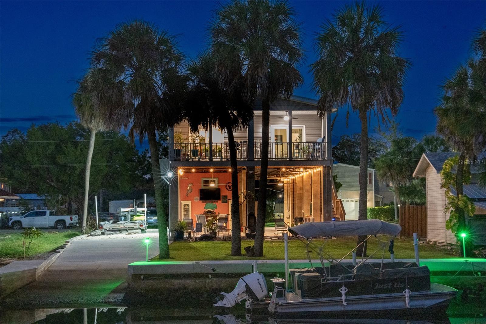 PRICE IMPROVEMENT !!! WELCOME HOME to this exquisite Waterfront Gulf Access 3 Bedroom/ 2.5 Bath Modular Home in Palm Grove Colony. It sits right in the middle of the Nature Coast on a Canal leading to the Mud River that connects to the Gulf and Weeki Wachee River. There are 9ft. Ceilings with Crown Molding throughout for an elegant touch. The Master Bath features a large Walk-In Closet and Under-Sink Outlets. HVAC has a 7-year Warranty. There is a 1-year-old Washer and Dryer Combo. The Open Floor Plan with Outdoor patio and Porch are perfect for Indoor/ Outdoor Entertaining Waterside. Nestled in this Quaint Community, this property faces South on the backside for beautiful Sunrises over the Weeki Wachee Preserve and Gorgeous Sunsets over the Gulf. Resting on High Stilts with Hurricane Impact Windows, it also features a 3-year-Old Metal Roof and 18 Helical Anchors.  This Home has its own private Boat Ramp for launching into the River. Just a short Kayak trip to the Weeki Wachee River, Rodger's Park and Local Restaurants including Upper Deck. There is a RV pad with a 50Amp Plug that has Sewer Hookups on both sides of the pad. It features 4 20Amp Outlets for a Downstairs Kitchen. The downstairs Plumbing and Electrical were designed for the Ceiling to be installed. For your Move-In / Investment Convenience this home is coming furnished. The Flood Insurance is pre-paid for 2 years and is assumable. You will fall in love with what the Community has for you and your guests. There are many Waterside Parks including the Weeki Wachee State Park featuring the Weeki Wachee Mermaids, Pine Island Park, Linda Pederson Park and a 11,000 acre Preserve for Hiking, Birdwatching and Photography all within minutes of each other. The best fishing areas in the Nature Coast. A perfect location for visitors coming for vacations to head to Disney and Universal Studios. Close to Tampa Airport with transports available. Come see your next Waterfront Home, Weekend Get Away or Short Term Rental Investment Property here in the Gorgeous Nature Coast.