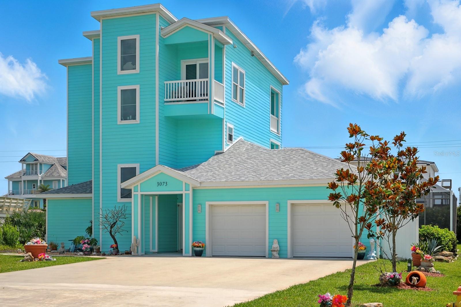 Welcome to 3073 Painters Walk—coastal living reimagined in one of Flagler Beach’s most coveted locations.
Built in 2022 with energy-efficient, ICF (Insulated Concrete Form) construction, this elevated three-story concrete block home offers the perfect combination of thoughtful design, rock-solid durability, and flexible living space—all positioned between the Atlantic Ocean and the Intracoastal Waterway.
Set on nearly half an acre, the property offers plenty of space for the pool of your dreams, and the backyard is already a peaceful haven where deer and wildlife roam. Best of all, directly across A1A is a private beach walkover reserved exclusively for Painters Walk residents, giving you effortless access to the quiet shoreline in just moments. To the west, enjoy stunning sunsets over the Intracoastal—this is truly a dream location.
Downstairs, two completely independent 1-bedroom apartments each feature a fully functional kitchenette with granite countertops and stainless steel appliances, modern bathrooms with walk-in tiled showers, in-unit laundry, and private entrances. The two units also share access to a screened-in patio—perfect for relaxing in the shade. Just beyond that is an additional large screened-in outdoor area, ideal for a future hot tub, outdoor dining, or simply enjoying the coastal weather. Whether you're hosting guests, welcoming extended family, or tapping into short-term rental income, these turnkey spaces are ready to perform.
A split 2-car garage offers secure parking and extra flexibility, whether you're storing beach gear, bikes, or creating a workshop or owner's storage space if you decide to rent.
Upstairs, the second floor is dedicated to the spacious owner’s suite, complete with a walk-in closet, luxurious en-suite bathroom, and a private balcony that overlooks the backyard and captures cool ocean breezes. A large laundry room with a utility sink and built-in cabinetry adds function and convenience.
On the third floor, you’ll find the heart of the home—a wide-open living, dining, and kitchen space surrounded by balconies on both sides, offering incredible sunrise and sunset views. The kitchen is outfitted with LG ENERGY STAR appliances, custom cabinetry, porcelain countertops, and a tiled backsplash. A fourth full bathroom adds flexibility for guests or everyday use.
Luxury vinyl plank flooring runs throughout the interior, and wood-look tile plank flooring finishes all exterior balconies—a perfect combination of durability and coastal style.
From top to bottom, this home was built with quality in mind: wind-mitigated roof, impact-rated doors and windows, and energy-efficient systems ensure comfort and peace of mind year-round.
An HOA maintains the private beach walkover and community standards, while preserving the low-key coastal charm that makes this neighborhood so special.
Prime location. Short-term rental potential. Ocean and Intracoastal views. 3073 Painters Walk offers a rare opportunity to enjoy the Flagler Beach lifestyle—whether you live here full-time, rent part of the home, or offer it as a full-time income-producing property.