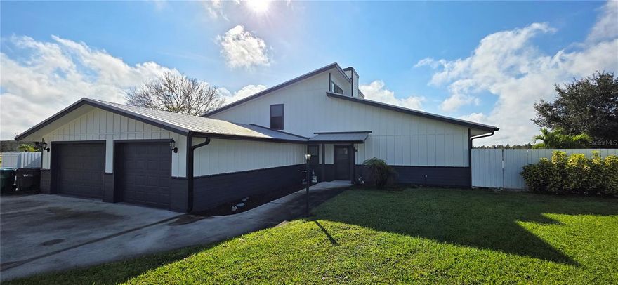 (Waterfront Living), Directly on the Kissimmee River, 100 FT of frontage. Charming 3 Bedroom 2 Bathroom with plenty of indoor and outdoor living. Enjoy water views and beautiful sunsets from multiple areas of the home. In the Greatroom,  High ceilings with clear finish tongue and groove Pine walls. Woodburning fireplace with a stone finish. The Primary Bedroom is located on the ground floor with an en-suite for your convenience. Nice screened-in back porch, and open patio with firepit and with sunset views on the river. Bedrooms #2 and #3 are located on the second floor with a Jack and Jill-style bathroom. There is an oversized 2-car garage, Also has an additional room for storing lawn equipment, tools, or toys. and another separate room for a small workshop. Fenced-in property with chainlink and a Partial privacy fence. Full concrete driveway. Beautiful Sunset views from your covered Boat dock with a covered seating area that is ideal for relaxing, and fishing. Includes an electric Boat Lift to accommodate a Pontoon boat or solid hull vessels.