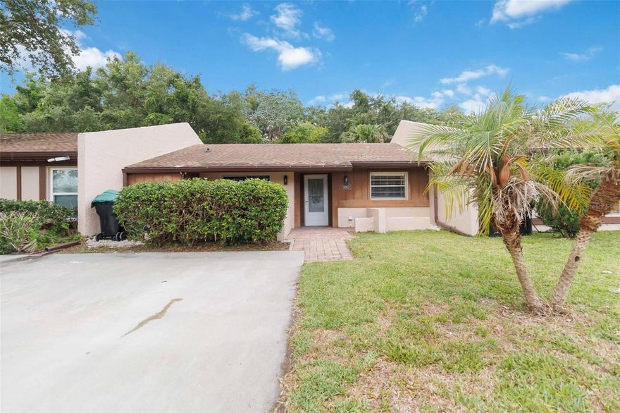 Cozy townhouse, located in a quiet community. Has a front porch. It has two bedrooms, a living room, and a dining area. The master bedroom has a door that leads out to the backyard. The bedrooms have ceiling fans.