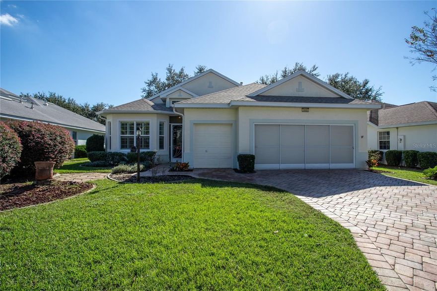 Sitting pretty, in the beautiful, 55 and better active adult community of Royal Harbor, this wonderful custom home is ready to welcome you home.  Located on the shores of Little Lake Harris, this gated waterfront community is one of a kind.  And this home has so many features, extras and updates, which include New Roof 2019, HVAC with 3 zones 2018, Solar Panels, Double Pane Windows, Beautiful Wood Laminate and Ceramic Tile throughout, Oversized Garage with work bench, Golf Cart Garage, Garage Screen, Insulated Garage Doors, Paver Driveway and Walkway, and more.  The huge, nicely appointed Kitchen will not disappoint. Abundant Solid Wood Cabinets with pull-outs, Corian countertops, large Pantry,  Stainless Steel Appliances, and wonderful windowed Dinette, all make this a Kitchen of your dreams.  Nice Open Floor Plan.  The Great Room opens, through two French Doors, to the Screened Lanai that has vinyl windows.  You will enjoy the mature trees and landscaping in your beautiful back yard.  A large concrete patio is perfect for your grill, table and umbrella, and a couple lounge chairs. After a fun day of activities, retreat to your spacious Master Suite.  Spoil yourself with the nice soaking tub and separate shower.  Walk out to the back lanai and sip your favorite drink. Your guests will appreciate the large Guest Room and Guest Bath.  And then there is the upstairs!  A beautiful stairway leads you to the third Bedroom or Bonus Room with a half bath and large walk-in storage closet and sliding doors that open to the wonderful balcony.  Ahh.. So many ways to use this great space.   Live your best life here in Royal Harbor. Do as much or as little as you like.  There is something for everyone.  Enjoy the resort-style Pool and Spa. Play Tennis, Pickleball, Shuffleboard or Bocce.  Walk or ride your bike on the trails. Enjoy the Clubhouse amenities, including a great Social Hall, Fitness Center, Arts and Crafts Room, Library, Billiards, and more.  There is even Storage for your Boat or RV.  Come see for yourself.  This is a great home in a great community, and I'd love to share it with you!