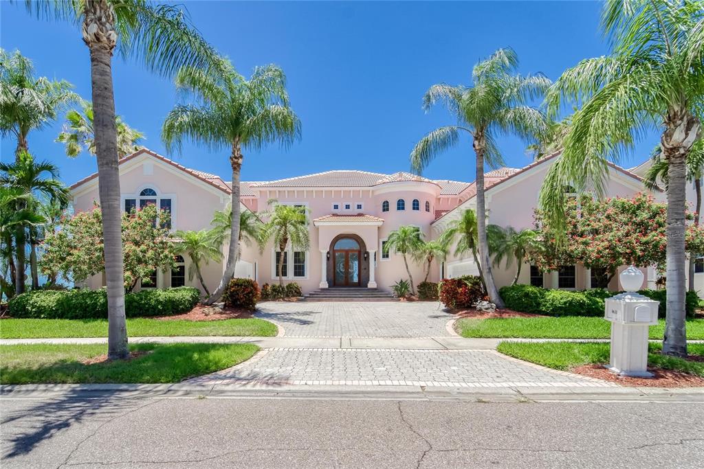 **WATERFRONT** Come home to this 6 bedroom 7 bathroom, POOL castle where you can see Tampa Bay from almost every room! The lightly refreshed kitchen opens to the family room and out to the pool deck with the most gorgeous sunset views. Dolphins are known for dancing in the sunset right in your backyard!! With formal living and dining areas, you are sure to have plenty of space for entertaining. The six bedrooms each have a private bath and multiple rooms even have balconies overlooking the bay! This home allows for everyone to have their own space while sharing multiple living spaces. In addition to the 6 bedrooms, there is also a media room perfect for your in-home theater. This open split plan has the master on the main with four other bedrooms up a grand staircase on the second level and an additional bedroom with its own private stairwell. The master is spacious with a luxurious en suite including a huge walk in shower, private laundry and jetted tub. The second floor has its own HUGE laundry room and kitchenette. If you want space, luxury and breathtaking views of the bay this home is for you! Be sure to bring the cars and boat because this four car garage is ready and waiting for you! Call today!