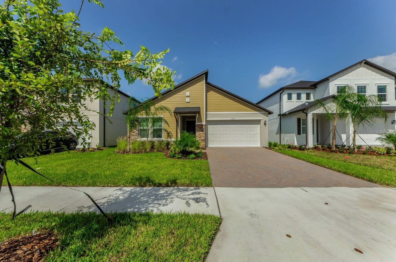 Modern Elegance would describe this brand new home. Modern exterior with a open floor plan. You can see front to rear when you enter the home. The bedrooms are set up with a 3 way split floor plan. As you enter the kitchen you will notice a bar with a wine fridge just prior to entering this fabulous kitcnen that has a large island and beautiful 42 inch cabinetry,Ceiling fans are currently being installed throughout the home. Beautiful new appliances and a butler pantry with plenty of storage space! Four bedrooms and three baths are good size and the Master bathroom feels and looks like a spa. This home is filled with cheerful natural light and beautiful finishing touches. The backyard includes a soon to be screened in patio space . Grounds maintenance included in rent! Small pets only please.Conveniently located within 15 minutes of all daily necessities, including banks, grocery stores, shopping, and dining. Easy access to major roads such as US-41, US-589, US-580, and SR-54 ensures a seamless commute and connectivity to surrounding areas. Zoned for highly rated schools such as Steinbrenner High School in the Tampa Bay area, this home offers both quality education opportunities and an unbeatable location. Don’t miss this incredible opportunity to be the first to live in this thoughtfully designed home! Call now for a private showing at your convenience.
