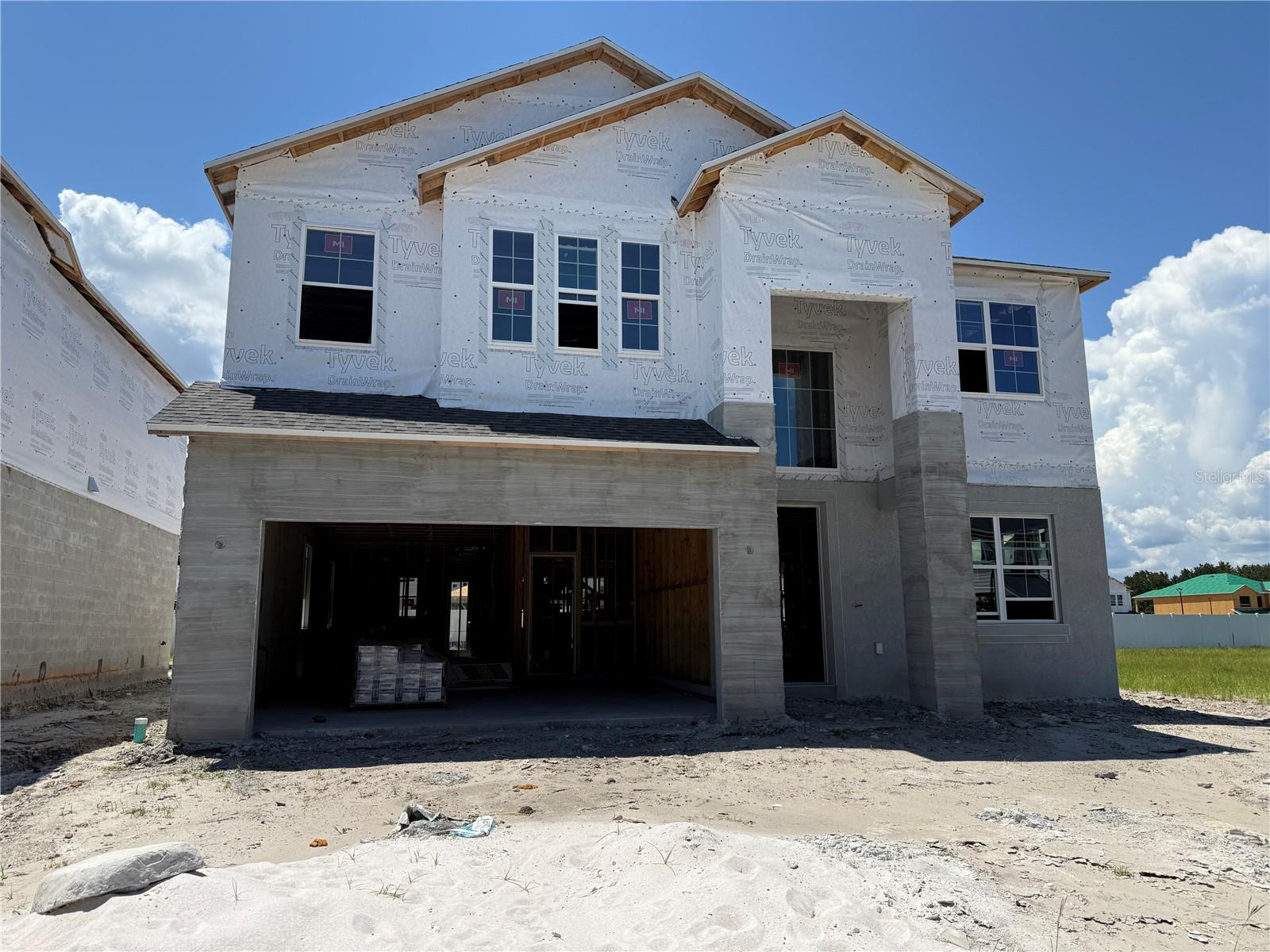 Under Construction. Discover this beautiful new construction home built by M/I Homes at 1152 Basalt Lane in Sanford! This impressive home offers spacious living, perfect for families seeking room to grow. Step inside and find the following wonderful design features, including 5 bedrooms–with a first-floor guest room–4 full bathrooms, an open-concept living space, a flex room, a lanai, a 3-car tandem garage, and much more! This thoughtfully designed home showcases quality craftsmanship with attention to detail in every room. The open-concept living space creates a natural flow between the kitchen, dining, and living areas, ideal for both everyday family life and entertaining guests. The upper level houses the owner's bedroom, offering a private retreat with an en-suite bathroom for relaxation and convenience. The additional bedrooms provide comfortable spaces for family members or guests. Located in Sanford, this home places you in a vibrant neighborhood with excellent access to local amenities.