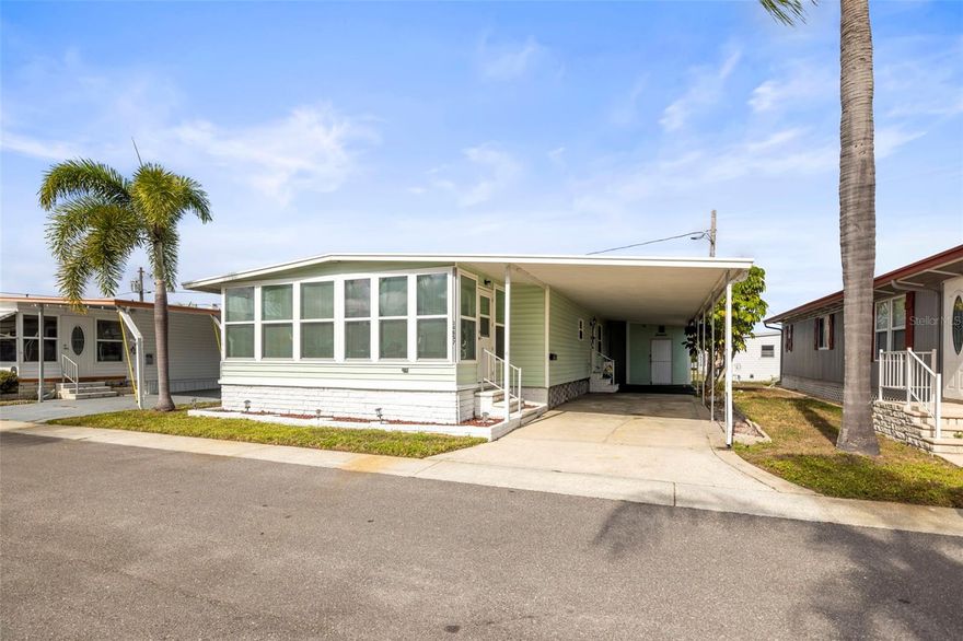 Embrace relaxed 55+ Florida living in this 2-bedroom, 2-bath mostly furnished home located in the “Quiet Gem” Sunset Palms Mobile Home Community. Featuring newer windows, easy-care LVP flooring, and an updated kitchen with quartz countertops, which offers comfort and a modern style. Laundry is sure to be less burdensome since the washer and dryer are conveniently located from the primary bedroom. The large sunroom, [200 extra sq. ft. NOT INCLUDED in the heated square footage, provides a bright and inviting space, ideal for relaxing, hobbies, or enjoying Florida living year-round.  Sunset Park is an active 55+ community offering a vibrant lifestyle with amenities such as a heated swimming pool, clubhouse, fitness center, shuffleboard courts, and a tranquil small lake. Residents enjoy a strong sense of community along with the convenience of a private back road allowing golf cart access to Walmart and nearby shopping. This is the perfect opportunity to enjoy low-maintenance living in a friendly, amenity-rich setting.  This home has a Share Valued at $55K.  Security Cameras in home are Owned.