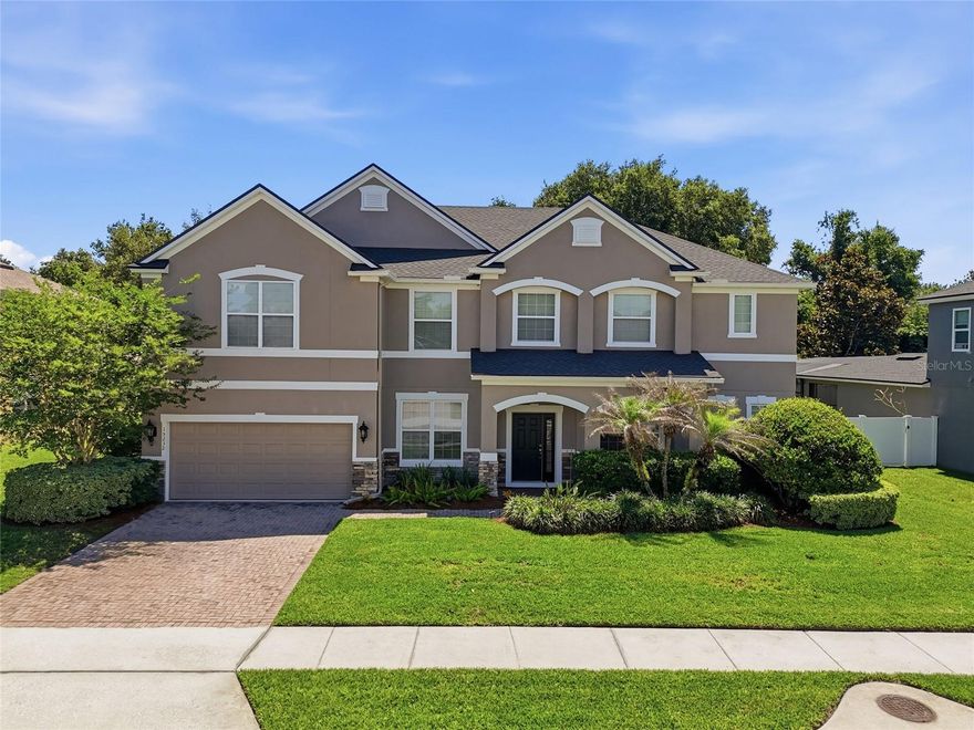 One or more photo(s) has been virtually staged. Located within the beautiful gated community of Belle Meade in Winter Garden, this exceptional 7-bedroom, 4-bathroom home offers the perfect combination of space, comfort, and lifestyle in one of Central Florida’s most sought-after locations. Freshly painted throughout and featuring a brand-new roof, this move-in ready residence provides peace of mind along with an expansive floorplan designed for modern living and entertaining. From the moment you enter, you’ll appreciate the bright open living spaces, soaring ceilings, and flexible layout ideal for large families, multigenerational living, or those needing extra space to work and entertain from home. The highly desirable first-floor primary suite creates a private retreat, while an additional first-floor guest suite offers convenience and versatility for extended family or visitors.
At the center of the home, the oversized kitchen overlooks the main living areas, creating a seamless flow perfect for gatherings and everyday living. The two car garage is tandem and set up for three cars or extra flex space. Upstairs, the home continues to impress with generously sized secondary bedrooms, a dedicated media room, and an expansive bonus room already prepped for a future bar area — creating the ultimate entertainment space for movie nights, game days, or hosting family and friends. Step outside and enjoy the Florida lifestyle with ample outdoor space and room to create your dream backyard oasis. Perfectly positioned near top-rated schools, Hamlin Town Center, Historic Downtown Winter Garden, Winter Park Village, shopping, dining, entertainment, major highways, and world-famous attractions like Disney, Belle Meade offers residents both privacy and convenience in a beautifully maintained gated setting. A rare opportunity to own a spacious, move-in ready home with the size, layout, and location today’s buyers are searching for.