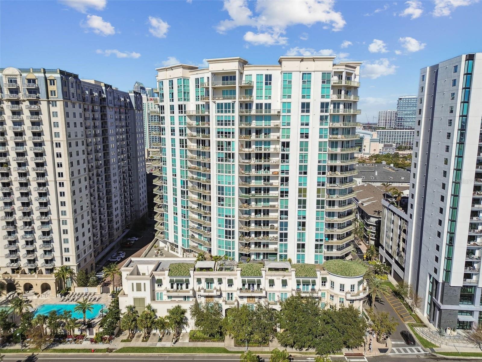One or more photo(s) has been virtually staged. Fabulous opportunity to purchase a 2-bedroom unit at The Plaza, one of the most preeminent buildings in all of Tampa, located on Harbour Island, consistently named one of the top places to live in the U.S. This 2 bedroom-2 bathroom (or 1 bedroom and den/office) unit features an open floor plan, bamboo hardwood floors, and stunning northeast views of the Water Street district, Benchmark International Arena (formerly known as Amalie Arena), the Channel District, and cruise terminals. Watch the cruise ships come and go and enjoy the fireworks several times a year over Sparkman Wharf. The kitchen has granite counters, 42” wood cabinets with crown detail , custom backsplash, a breakfast bar, and stainless-steel appliances. The open floor plan features a large living area and dining area with access to the unit-wide verandah. The owners’ suite boasts a large bedroom with access out to the balcony, en suite bathroom with double vanity and undermount sinks, granite countertop, soaking tub, walk-in shower, and a custom walk-in closet. The second bedroom could easily accommodate a Murphy bed and do double duty as a home office, and there is an adjacent full bathroom including an upgraded vanity with granite counter. The dedicated laundry room includes additional storage space; the washer and dryer convey with the unit. The amenities at The Plaza are unparalleled: resort-style infinity edge heated pool and spa, valet parking, 24-hour front desk coverage: full-time on-site staff: concierge, property manager and assistant property manager, building engineer and his assistants; two community rooms, fully outfitted wellness center, spa room with massage table, sauna, business center, two conference rooms, and 4 EV chargers. All interior and exterior common areas have undergone a recent renovation. Harbour Island offers walking distance to shops, restaurants, the Tampa Riverwalk, Sparkman Wharf and the Water Street district. Take advantage of convenient access to downtown Tampa and St. Pete, all major roads, interstates, and TIA. Buyer to make a one-time contribution of 0.2% of the purchase price to the Plaza capital reserve fund at closing.