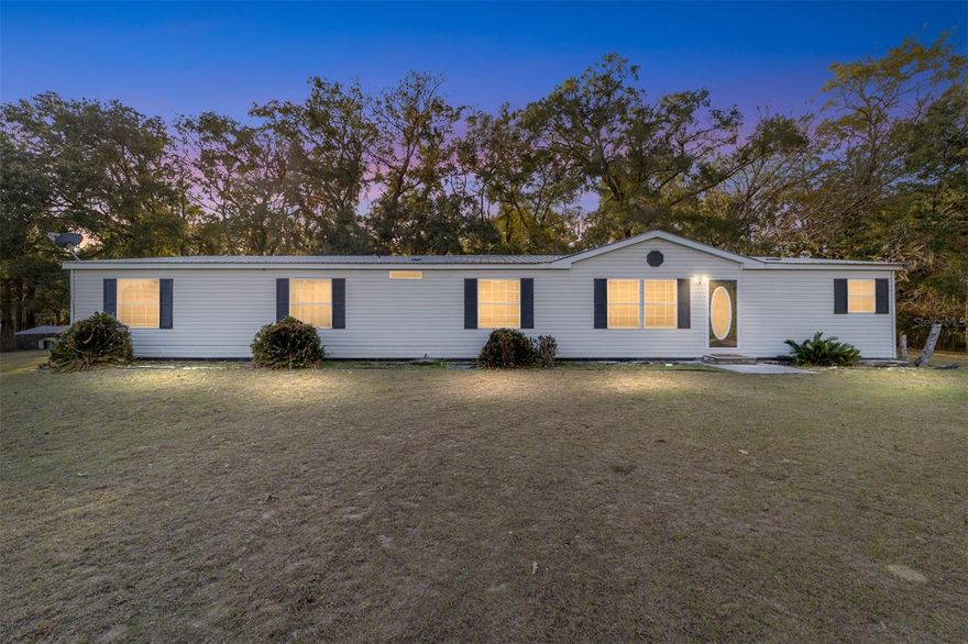 Welcome to this gem of a home located on nearly 2.5 acres. This home is located in Alachua, Florida- just a quick drive to Gainesville and High Springs, and just a skip away to Downtown Alachua. With 4 spacious bedrooms and 3 full baths on a layout on over 2200 sq feet, you won't want to overlook this! Walk inside and discover a beautiful modernized interior with incredible yet practical features such as a cozy wood-burning fireplace, double paned windows, walk in closets, an eat-in dining and kitchen space, and a wonderful screened in patio. Head out to see a 50 x 50 fence installed on the property made perfect to hang out and host in your own backyard. This home has a newer roof, a new water heater, brand new dishwasher, and key pad locks on the door. The master bathroom features a dual sink, a large tub, and a shower.  Don't miss the opportunity to raise your family, your animals, or your garden here.