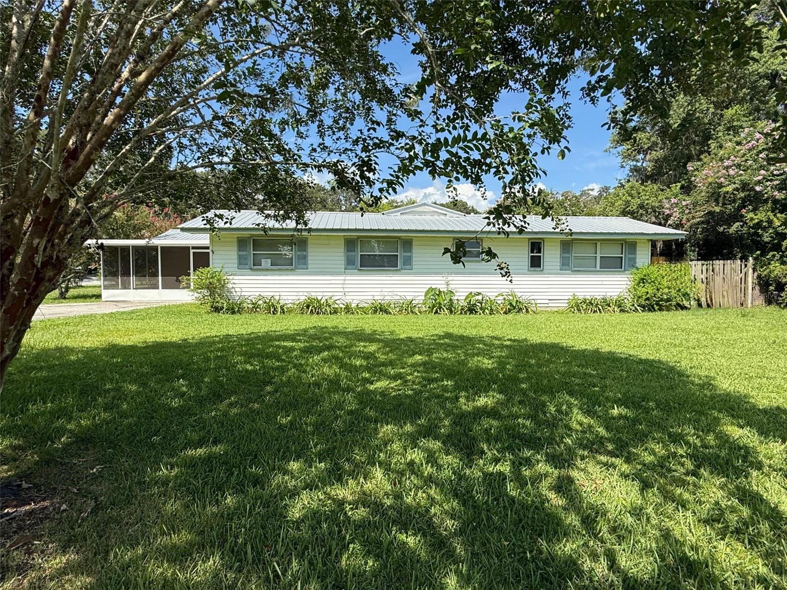 **OWNER FINANCING AVAILABLE WITH QUALIFIED DOWNPAYMENT** Welcome to this charming 4/2 located in Country Club Estates - less than a mile from historic downtown Brooksville and walking distance to Hernando High School! This home features a light and bright kitchen with quartz cabinets and a breakfast bar open to the living room. LVP flooring in the living area, neutral paint, and plenty of storage. The functional layout has a great room, formal dining area, a spacious utility room and 4 well-appointed bedrooms including a primary ensuite with a private bathroom. There's plenty of outdoor space with two oversized, screen porches - one on the front and one in the back! All this PLUS a large corner lot (.4 acres). METAL ROOF AND NEWER HVAC! Make an appointment today before this one is gone!