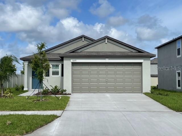 Enjoy this newer home in Wimauma! 3 bedroom, 2 bath, 2 car garage. Inside laundry. Tile floor in common areas, carpet in bedrooms. Open floorplan. Make this your home today!