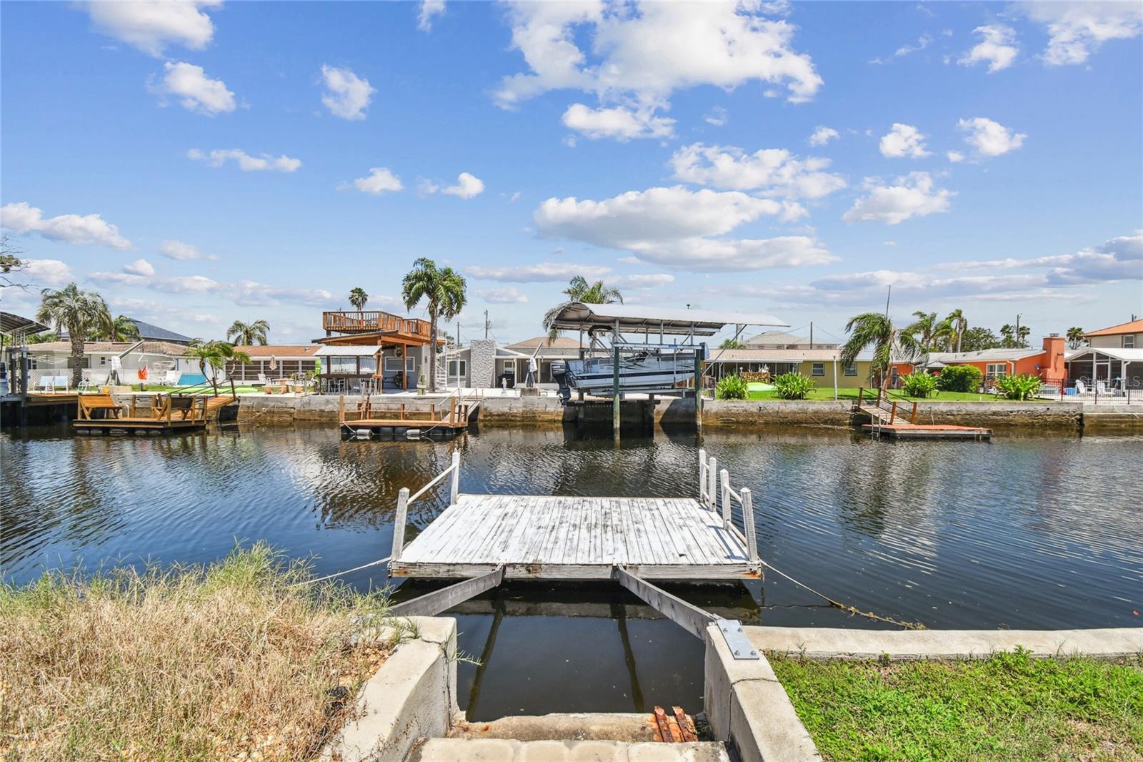 This charming WATERFRONT move-in-ready 2-bedroom home in Hudson, FL, offers the perfect blend of waterfront living and convenient access to the best of the Gulf Coast lifestyle.
New Paint, Kitchen , flooring etc! come check it out
!Open Gulf Access: Experience effortless adventures on the open Gulf from your private dock. Close Proximity to Hudson Beach: Spend your days relaxing on the beautiful sands of Hudson Beach, just a short distance away. Near Schools and Shops: Benefit from the convenience of nearby schools and a variety of shops for all your daily needs.