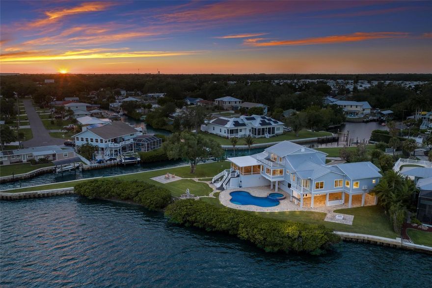 Welcome to a Rare, Private Peninsula Estate offering over an acre of prime waterfront living, where breathtaking panoramic views stretch across both canal and river waters. Tucked away at the end of a quiet street, this exceptional property delivers unmatched privacy, open space, and a true connection to Florida’s natural beauty complete with frequent sightings of dolphins and manatees just beyond your backyard.



Designed for those who value both luxury and lifestyle, the home features deep-water access with no fixed bridges, making it ideal for boating enthusiasts. The property has been extensively enhanced with a 700FT BRAND NEW SEAWALL , dredged waterways providing optimal depth for smooth navigation, a high-capacity boat lift 20,000 lbs  , and a dedicated jet ski lift 6,000 lbs, creating a turnkey waterfront experience. As an added exceptional BONUS, a custom 2021 Aviara BOAT IS INCLUDED, allowing you to immediately enjoy life on the water.



Inside, the residence captures stunning water views from nearly every room. The spacious layout includes multiple bedrooms with en-suite baths and balconies, soaring ceilings, and an open-concept design that blends comfort with elegance. The chef’s kitchen wolf appliances , with two refrigerators is equipped for entertaining, while expansive living areas flow seamlessly to the outdoor spaces. Smart home features include  whole house camera system. 



Step into your private outdoor oasis featuring a gas heated saltwater pool and 10 person Hot-Tub, an expansive lanai with built in smoker, and multiple areas and two different fire pits to relax or host gatherings , all framed by incredible sunrise and sunset views. Recent upgrades elevate the home even further, including NEW flooring, multiple NEW A/C systems, NEW renovated lanai enhancements following down to NEW Composite decking , ensuring long term durability and ease of maintenance, NEW garage doors, NEW exterior paint, and NEW upgraded enhanced landscaping lighting, ensuring both style and functionality. Use your own private beach to launch your kayak or paddleboard.



With its oversized lot, circular drive, split 4 car garage, and abundant space for entertaining, this property is truly one-of-a-kind. Located just a short boat ride to the Gulf and conveniently situated between Tampa and Sarasota, it offers the perfect balance of seclusion and accessibility.



This is not just a home it’s a waterfront sanctuary on a peninsula, where every day feels like a getaway.
Be sure to check out the virtual tour.