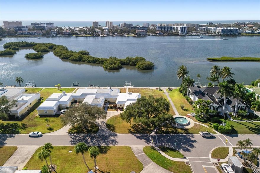 This spectacular end-unit waterfront villa offers the ultimate in Florida coastal living, complete with
deep-water access to the Intracoastal Waterway and Sarasota Bay. A truly rare opportunity, the
property includes a private boat slip equipped with an IMM Quality Boat Lift (10,000 lbs), capable of
accommodating a large boat for boaters seeking effortless backyard access to open water. Remodeled
from top to bottom in 2025, this light and bright maintenance-free villa feels entirely brand new. As you
enter through the front door, you are immediately welcomed by sweeping open-water views and
preserved sunset vistas that create a serene and unforgettable backdrop for daily living.
Situated on an end lot with an open park-like green space along the north side, the home offers
exceptional privacy and an expanded sense of openness. Frequent dolphin and manatee sightings paired
with vibrant sunsets make this setting truly special. Inside, the home features a beautifully designed
split-bedroom layout, with the master suite on its own wing for enhanced privacy and the guest
bedroom positioned at the front of the home, ideal for hosting family and friends while maintaining
comfortable separation. The entire interior is finished with luxury vinyl flooring, providing durability,
modern style, and a seamless unified look. The chef’s kitchen serves as the heart of the home,
showcasing high-end GE stainless steel appliances, Brazilian marble countertops, a farmhouse sink, grey
wood cabinetry, a spacious center island, and an oversized walk-in pantry. And a built-in beverage
cooler between the lower cabinets, further enhancing the kitchen’s functionality and appeal. Thoughtful
upgrades throughout the home add both comfort and sophistication.
Step outside to your private slip and heavy-duty lift, offering an exceptional setup for larger boats and
providing quick, easy access to fishing, cruising, and the Gulf of Mexico. For avid boaters, this location is
truly unmatched. Bay Colony Villas is a warm and active community featuring a newly remodeled 1,800
square foot clubhouse with a full kitchen, game room, billiards room, and a heated swimming pool all
just steps from your front door. Monthly condo fees include exterior maintenance, exterior hazard
insurance, water, lawn care and full use of community amenities. Perfectly positioned near shopping,
dining, Downtown Sarasota, and world-famous Siesta Key Beach, this villa combines exceptional
convenience with the best of coastal living. With preserved sunset views, modern upgrades, deep-water
boating access, and a private slip with a high-capacity boat lift, this one-of-a-kind home is ready for its
next owner to experience the Florida waterfront lifestyle at its finest.