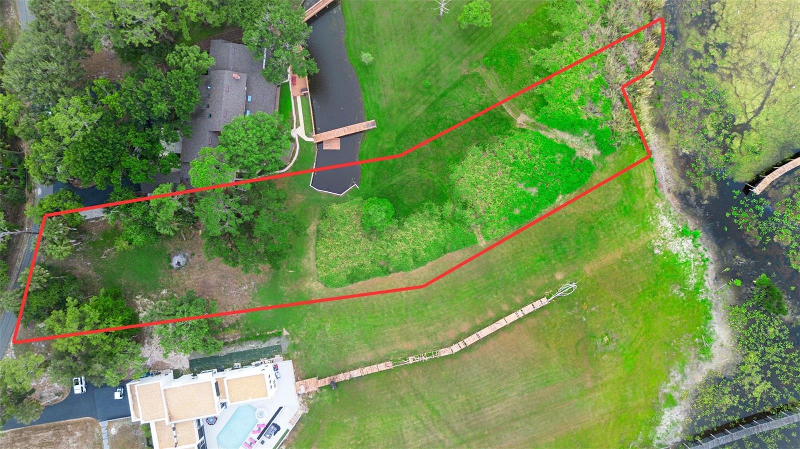 Waterfront Lot in Historic Enterprise – Build Your Dream Home in Stone Island! Here’s a rare opportunity to own waterfront property in the historic district of Enterprise, Florida — a charming community established in 1841. Welcome to Stone Island, a unique, golf cart-friendly neighborhood that offers an exceptional lifestyle surrounded by natural beauty. This 1.18 -acre vacant lot sits directly on Lake Monroe, offering the perfect canvas to build your custom dream home. With the potential to add a private boat dock (subject to county regulations), you can truly embrace waterfront living at its finest. Stone Island offers a range of community amenities, including horse stables, tennis and pickleball courts, and a private boat ramp, all set within a serene, nature-filled setting. Just minutes away, enjoy nearby attractions such as Mariner’s Cove Park, Green Springs, and the scenic East Central Regional Rail Trail — perfect for walking, biking, and exploring. Experience a lifestyle of comfort, connection, and understated luxury in one of Central Florida’s most historic and picturesque areas. Don’t miss this opportunity to create your ideal home in a truly special place.